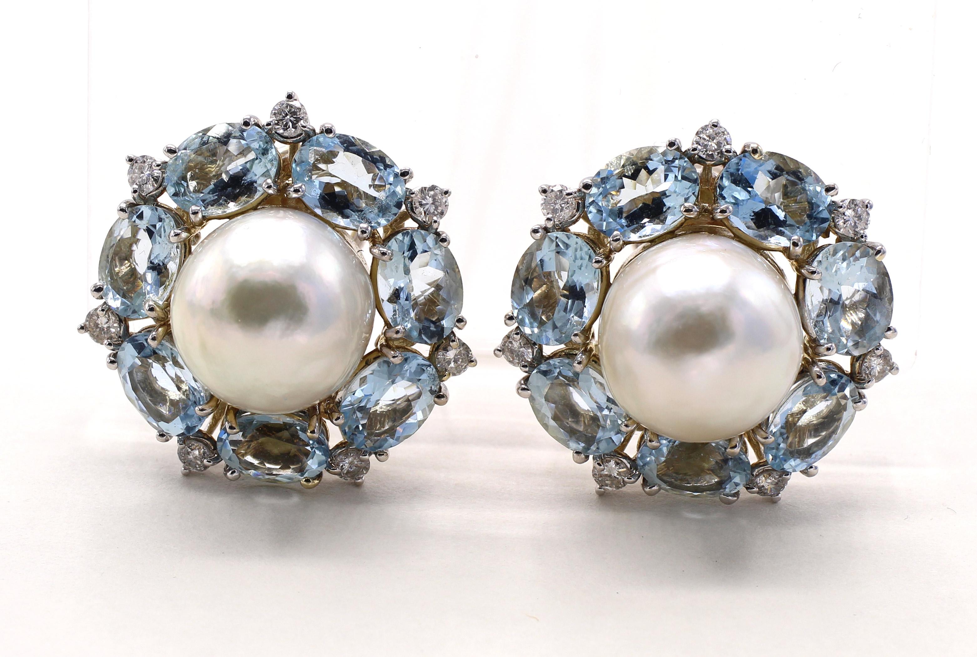 These gorgeous 1970s ear clips were designed and manufactured by the renown American jeweler Seaman Schepps. The 18 karat white gold earrings are centrally set with 2 white and extremely lustrous South Sea pearls, surrounded by 7 perfectly matched