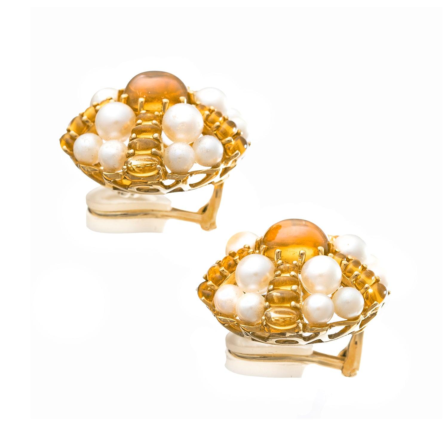 Sea urchin domed earrings in 18k yellow gold, centering a larger cabochon-cut citrine surrounded by descending rows of smaller cabochon-cut citrines and cultured pearls.

Clip-style French backs (posts may be added upon customer request).  Signed
