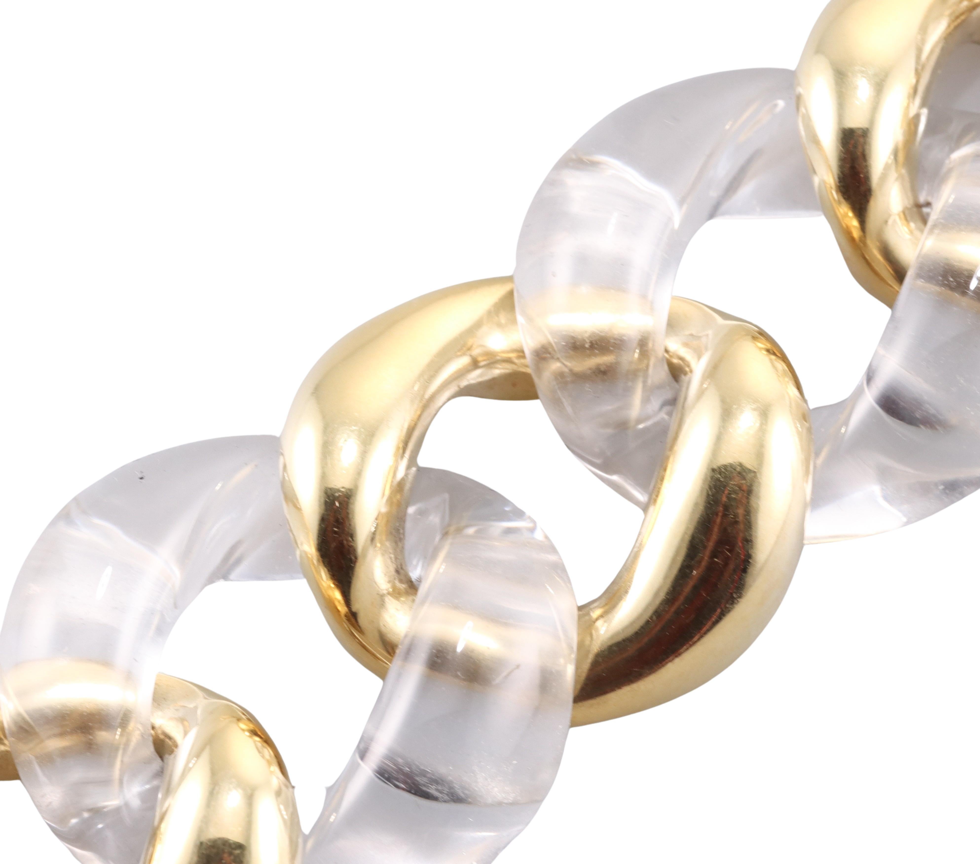 Klassisches Gliederarmband von Seaman Schepps, gefasst in 18 Karat Gelbgold, abwechselnd mit Gliedern in Bergkristall. Das Armband ist 7 7/8