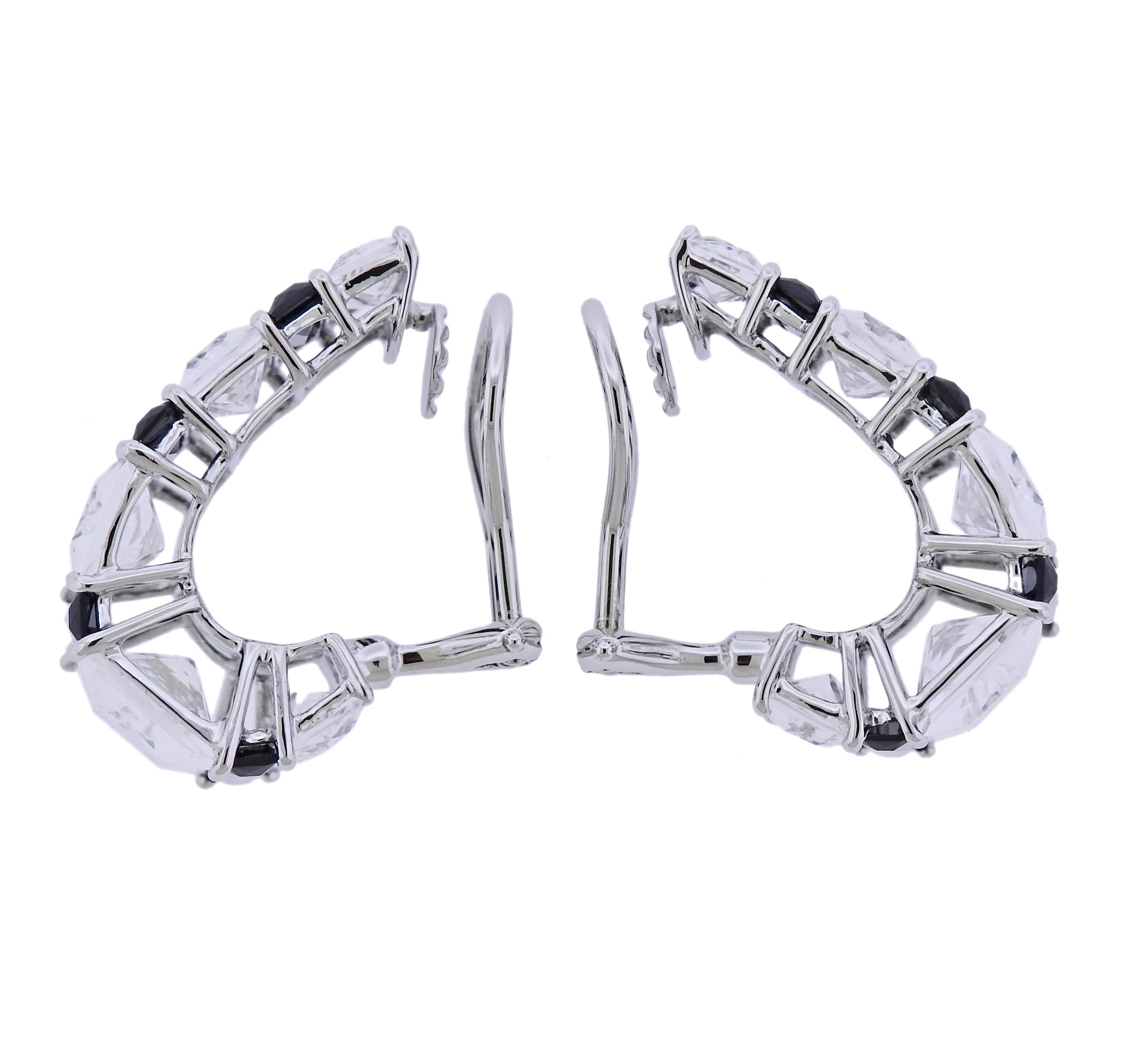 Pair of new 18k white gold half hoop earrings by Seaman Schepps, set with carve crystal and black onyx. Earrings are 23mm x 16mm, weigh 13.7 grams. Marked: 245394, 750, Shell hallmark. 
