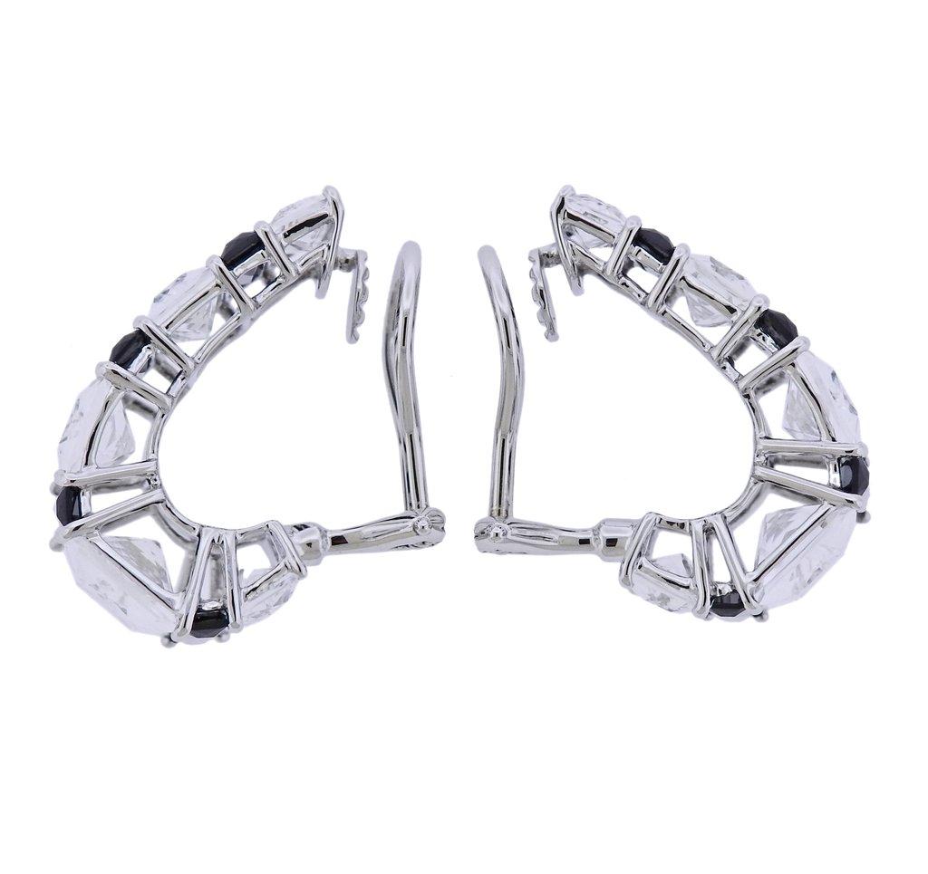 Pair of new 18k white gold half hoop earrings by Seaman Schepps, set with carve crystal and black onyx.  Earrings are 23mm x 16mm. Marked 245394, 750, Shell hallmark. Weight 13.7 grams. 

