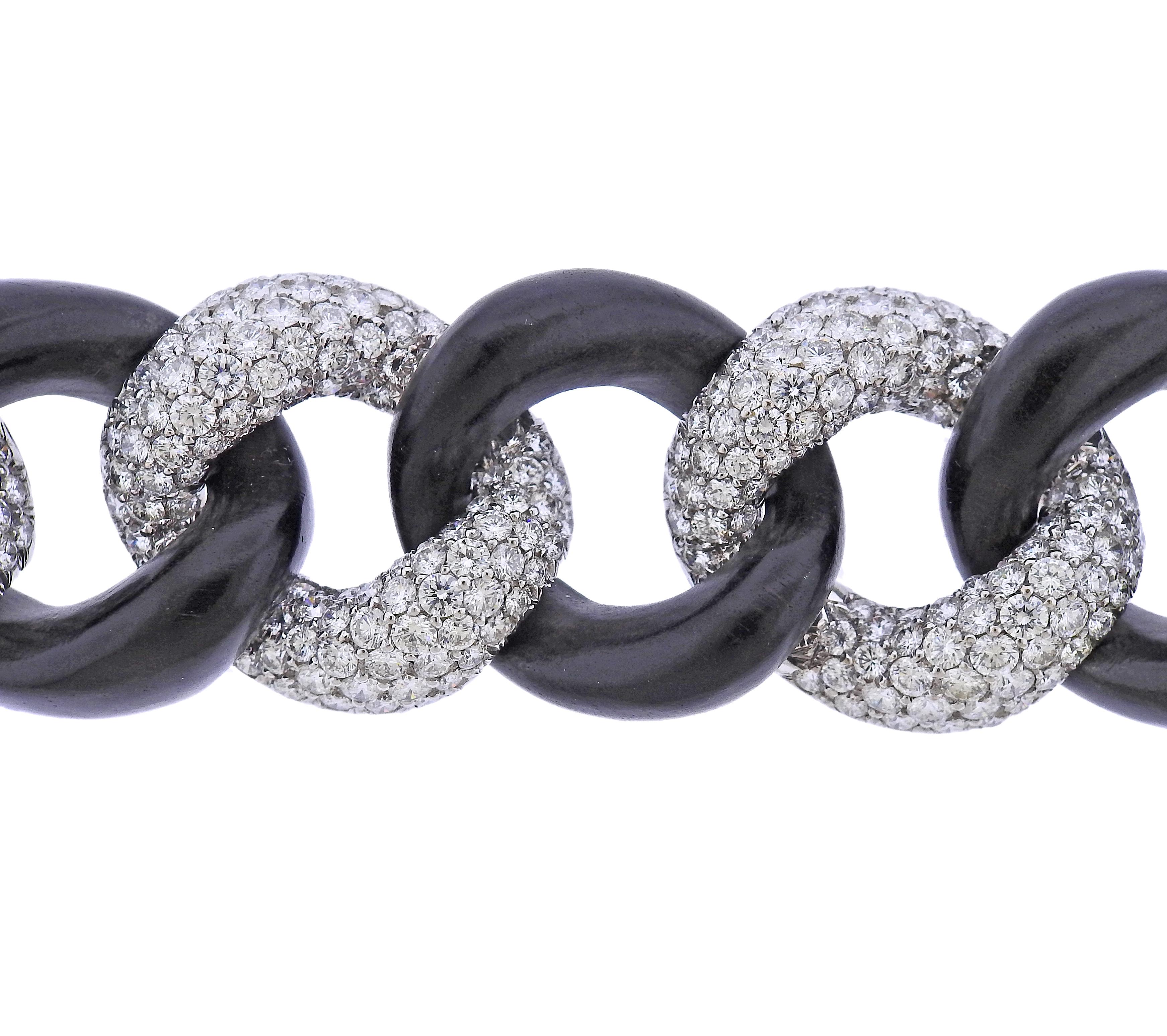 Exquisite Link bracelet by Seaman Schepps ,in 18k white gold and ebony wood, with approx. 32cts in G/VS diamonds. Retail $143,650.00. Comes with box. Bracelet is 7