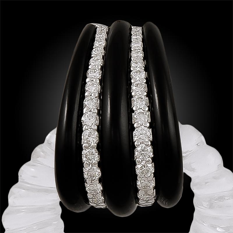 SEAMAN SCHEPPS Crystal Onyx Diamond Detachable Earrings in 18k White Gold.

A gorgeous pair of detachable on-the-ear clips by Seaman Schepps comprising reeded rock crystals and fluted onyx, embellished with brilliant round diamonds. The