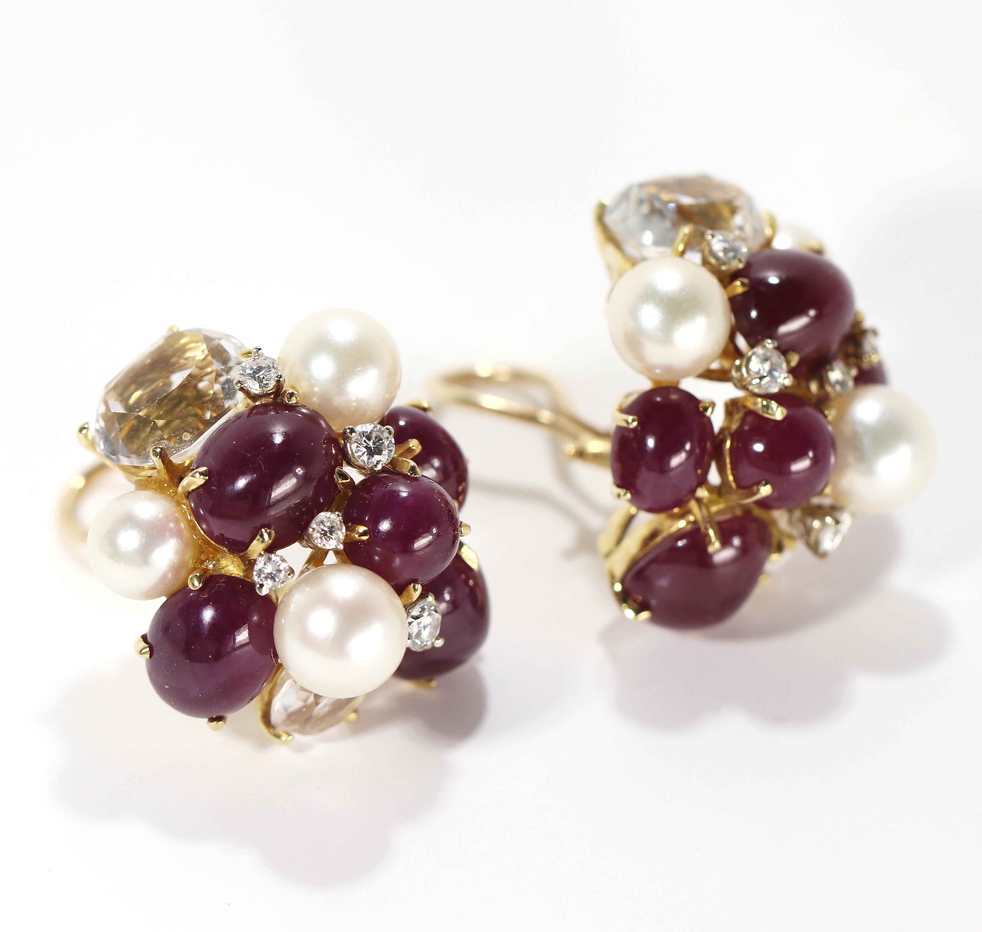 This Seaman Schepps signature pair of  Bubble earrings in 18K yellow gold is set with diamonds, rubies, pearls and faceted quartz crystal. With the firm's trademark Bubble design, there are 10 diamonds weighing a total of approximately 1.00ct, and