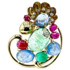 Spilla floreale Seaman Schepps con zaffiro cabochon, smeraldo, rubino e diamanti