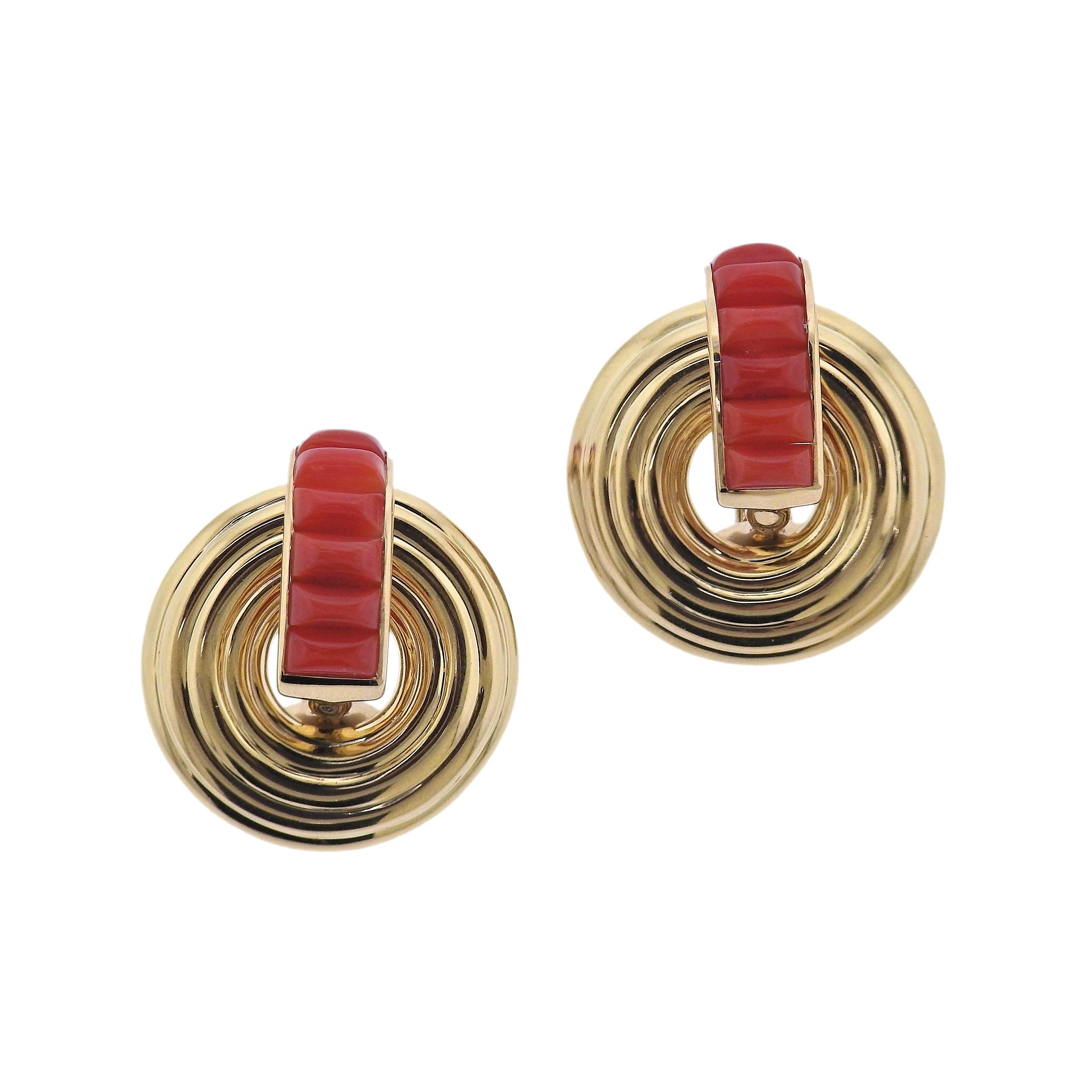 Brand new pair of Giro reversible and versatile earrings by Seaman Schepps. Set in 18k yellow gold, with white ceramic and coral. Come with packaging.  Earrings are 25mm x 21mm, circles are reversible and removable. Weight - 15.2 grams. Marked: