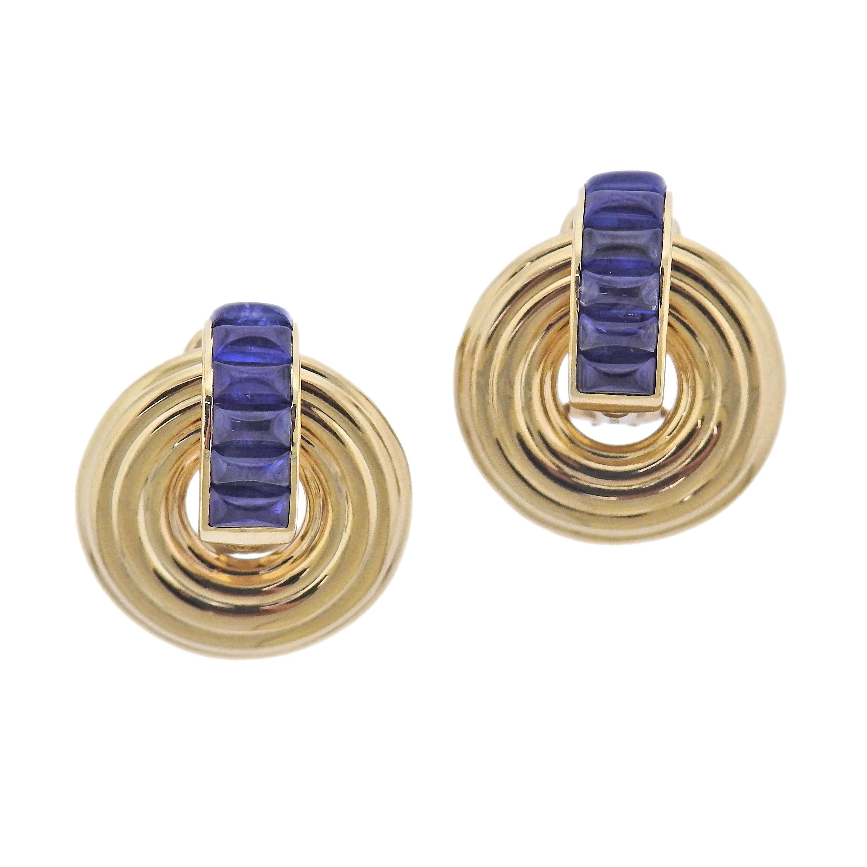 Brand new pair of Giro reversible and versatile earrings by Seaman Schepps. Set in 18k yellow gold, with white ceramic and sapphires. Come with packaging.  Earrings are 25mm x 21mm, circles are reversible and removable. Marked: 248753, 750, Shell