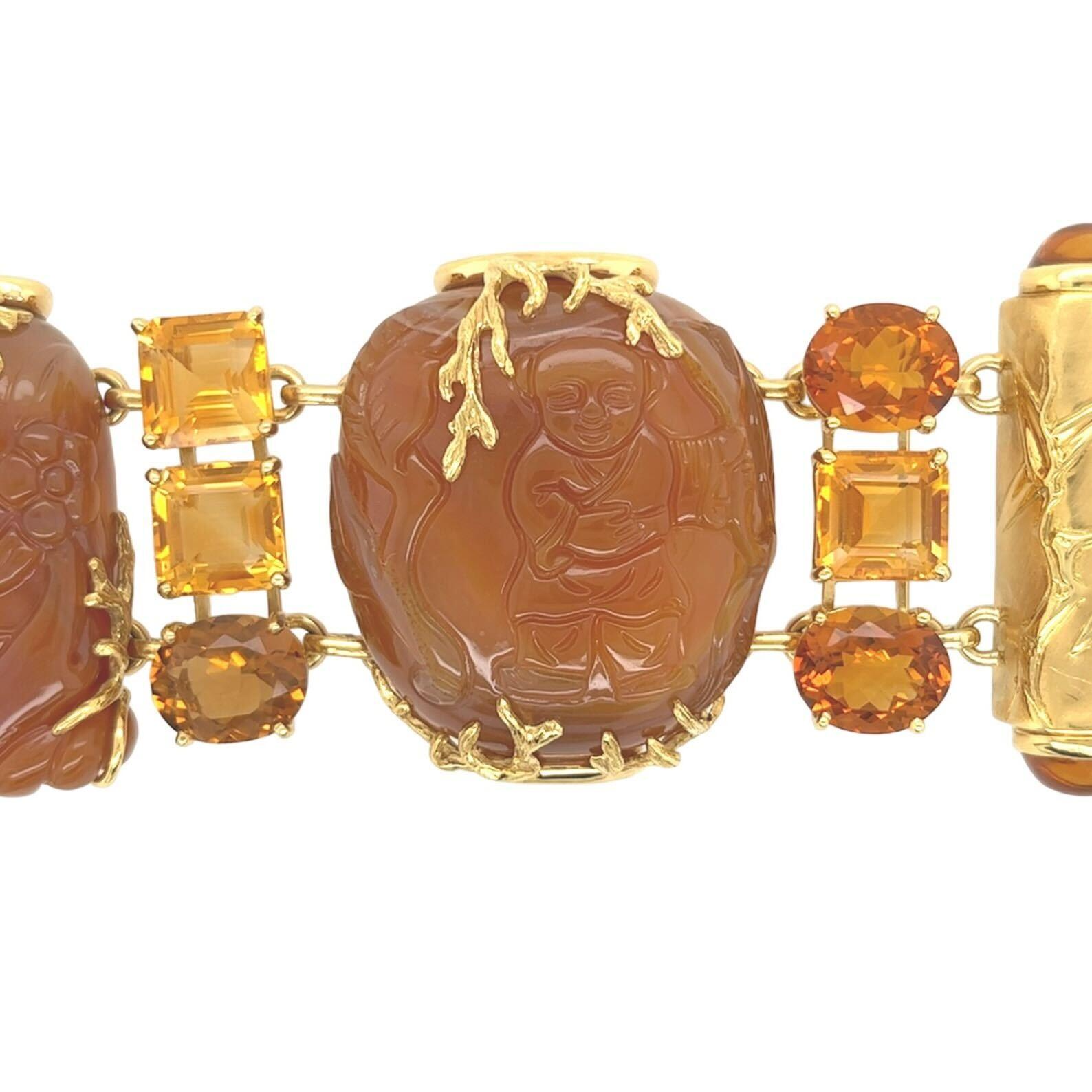 An 18 karat yellow gold, carnelian and citrine bracelet, Seaman Schepps.  The bracelet composed of three (3) carnelian snuff bottles held by foliate form arms alternating with three (3) rows of oval faceted deep orange citrines and square step cut
