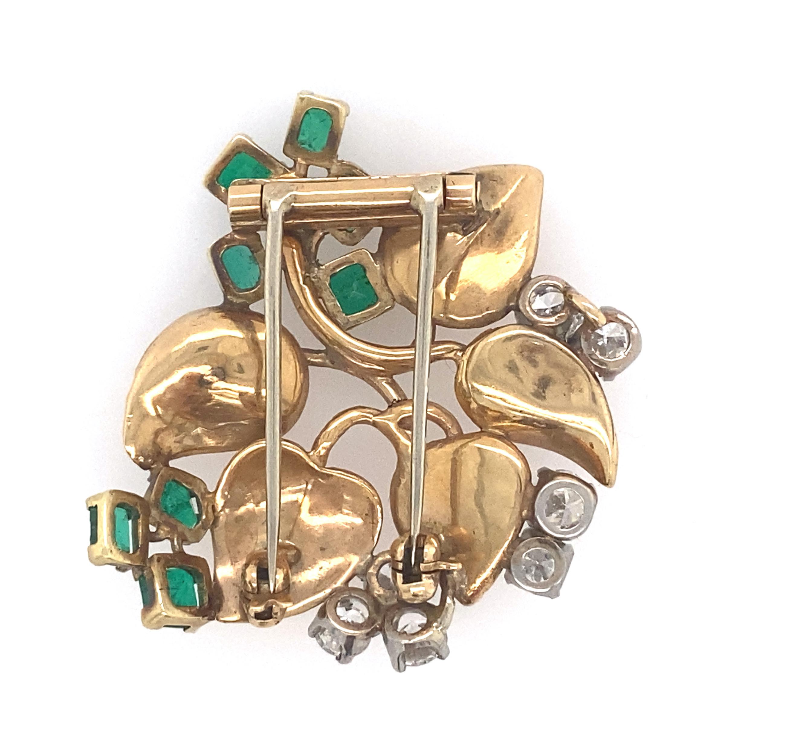 Seaman Schepps Gold, Diamond and Emerald Leaf Clip-Brooch
7 old European and transitional-cut diamonds ap. 1.55 cts., 
8 rectangular step-cut emeralds ap. 2.00 cts., 
signed Seaman Schepps, c. 1940, ap. 10.4 dwts.
measurements 1 5/8 x 1 5/8 inches.