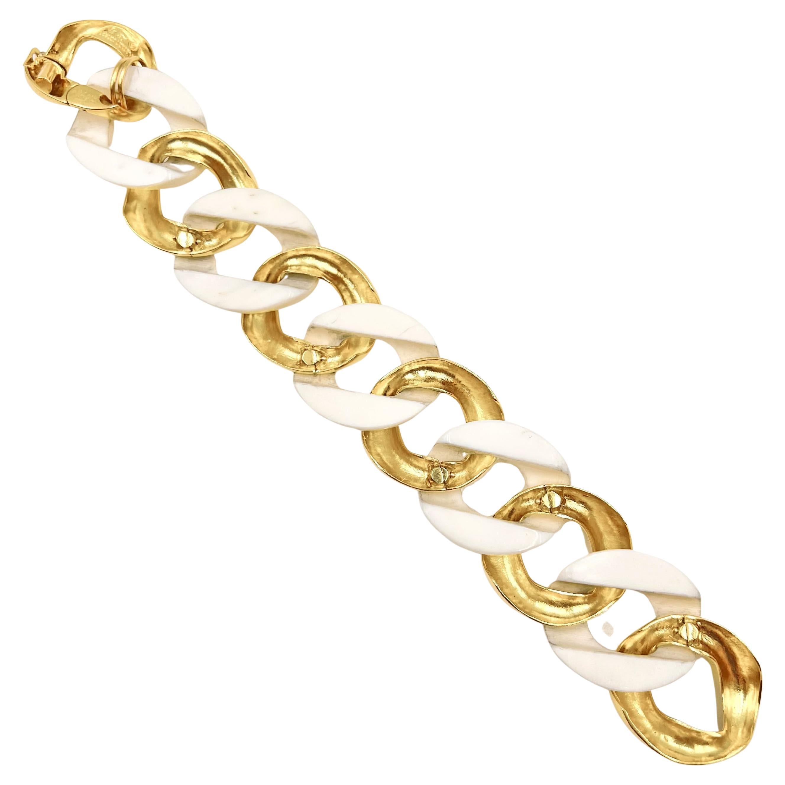 Seaman Schepps classic bracelet in alternating white ceramic and 18k yellow gold links. Measuring 7
