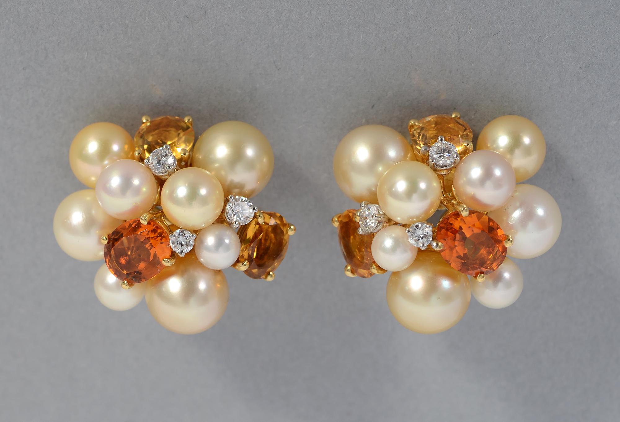 Large and elegant cluster Bubble earrings by Seaman Schepps. The earrings combine 7 pearls of different sizes; three oval citrines in two colors and three round diamonds. The stones are mounted at different heights and angles giving a less formal