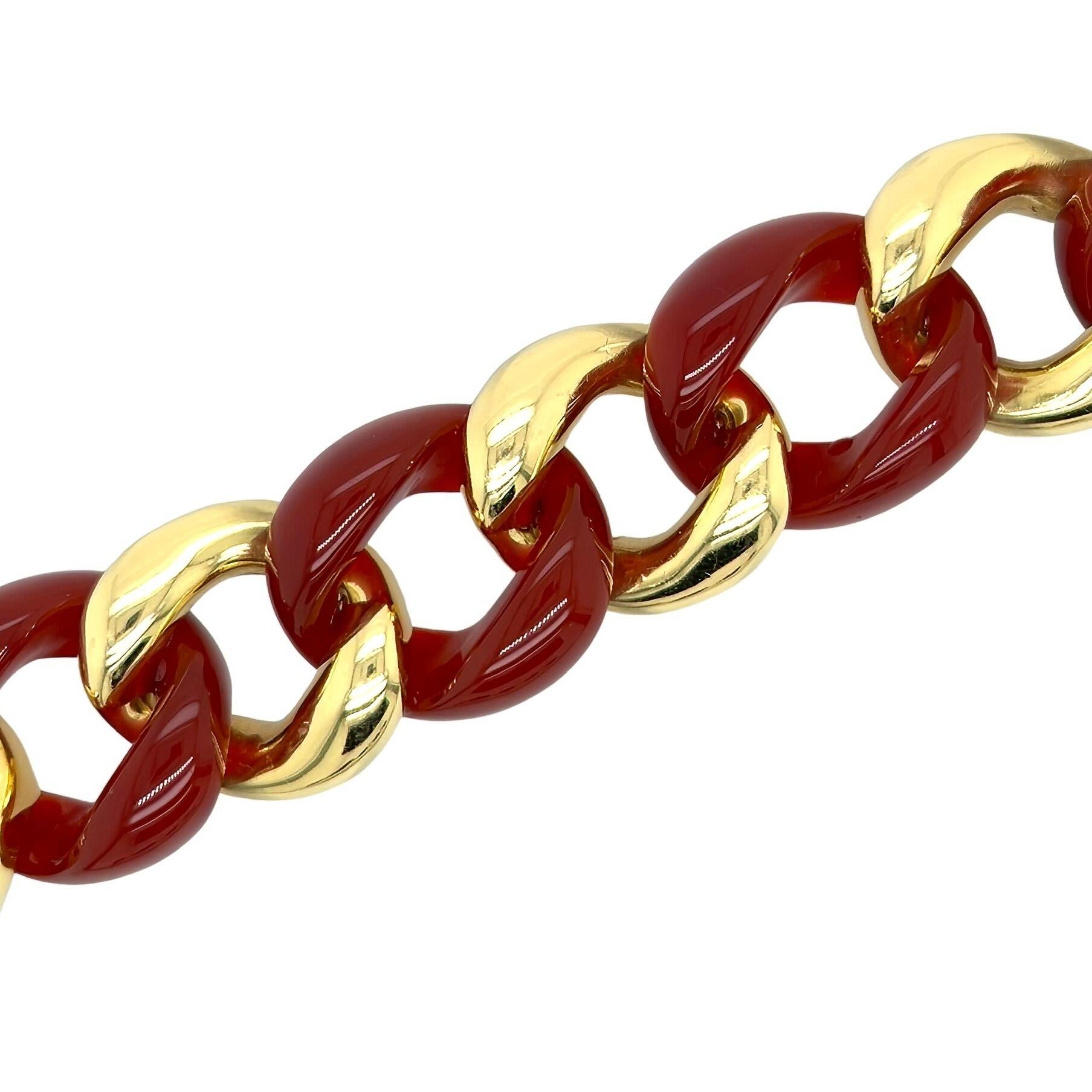 An 18 karat yellow gold and carnelian bracelet, Seaman Schepps.  Designed as a large link bracelet of alternating carnelian and gold curb links.  Length approximately 8 inches.  Gross weight approximately 106.60 grams.  Signed Seaman Schepps with