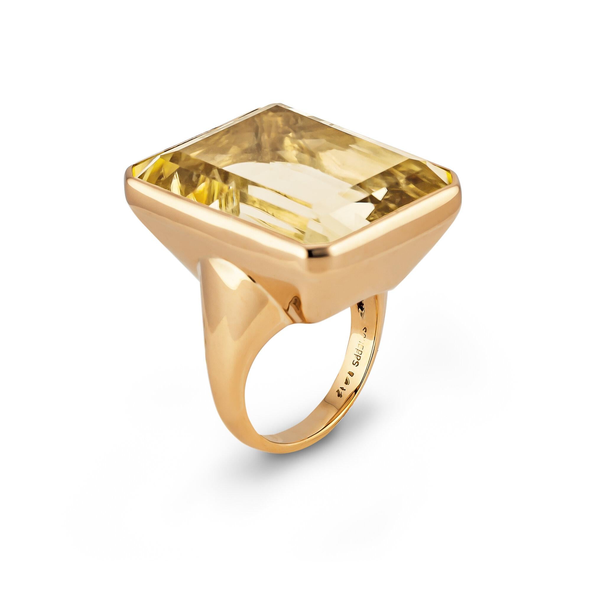 Streamlined and sleek, this Seaman Schepps mid-century 40 carat emerald cut citrine ring is both fun and chic.  With an ultra modern 14 karat yellow gold handmade mounting, this circa 1940-45 ring is a real show stopper.  Signed Schepps.  Size 6 and