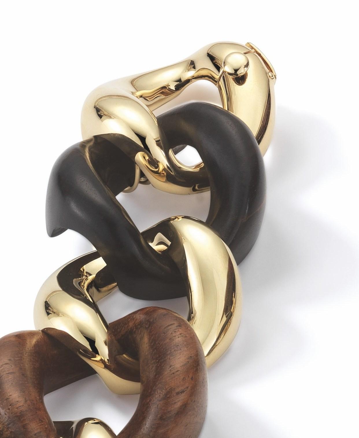 Brand new 18k gold classic large link bracelet featuring rosewood, walnut wood, ebony, and sandal wood links. Crafted by Seaman Schepps. Bracelet measures approximately 7 3/4 inches long, links measure 25mm wide. Weight is 72.5 grams. Marked Seaman