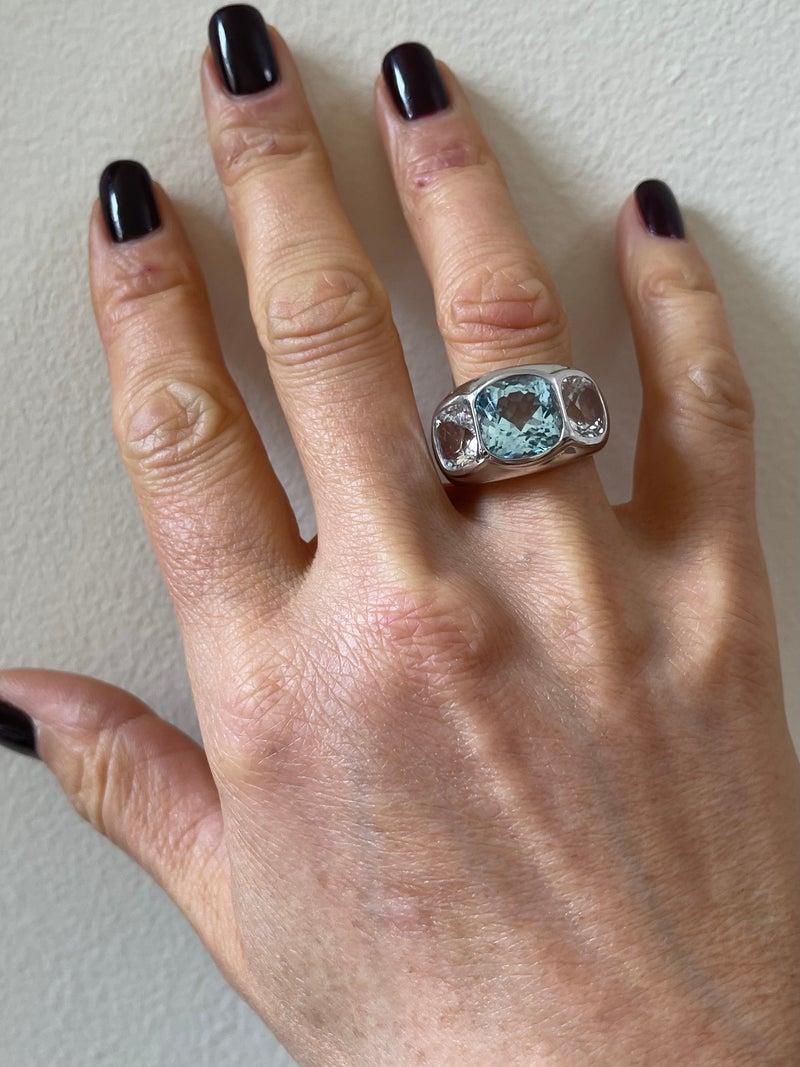 Brand new Seaman Schepps Mogul collection white and blue topaz ring. Ring size 6.5, ring top is 15mm wide. Blue Topaz- 5.62, White Topaz- 2.45. Marked:  Seaman Schepps, Shell mark, 750, 248223.  Weight - 13.5 grams.