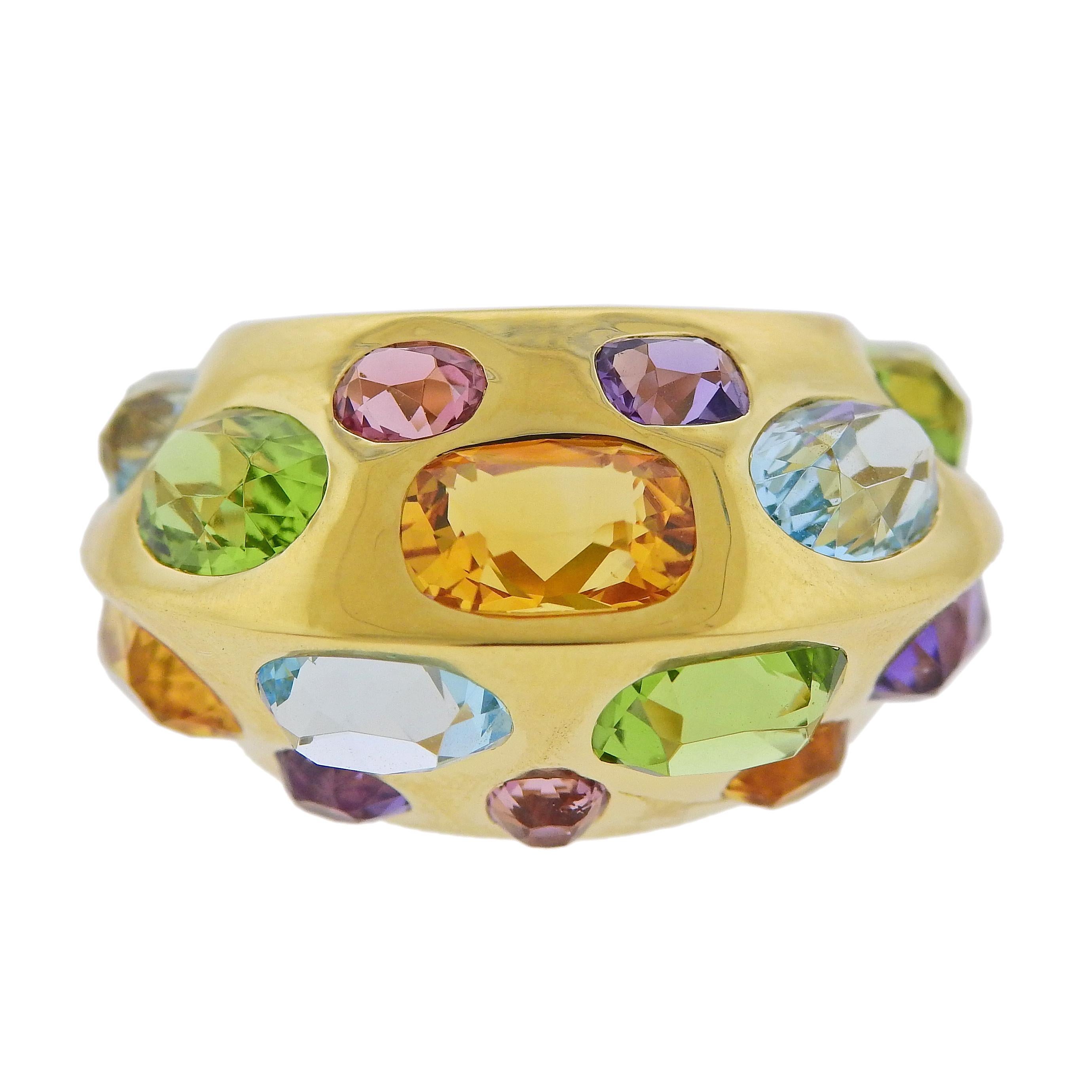 New 18k gold dome ring by Seaman Schepps, set with multi color gemstones. Ring size - 6.5, ring top is 15mm wide, weighs 10.5 grams. Marked: 750, Shell hallmark, 247750. Features topaz, pink tourmaline, citrine, peridot, amethyst.