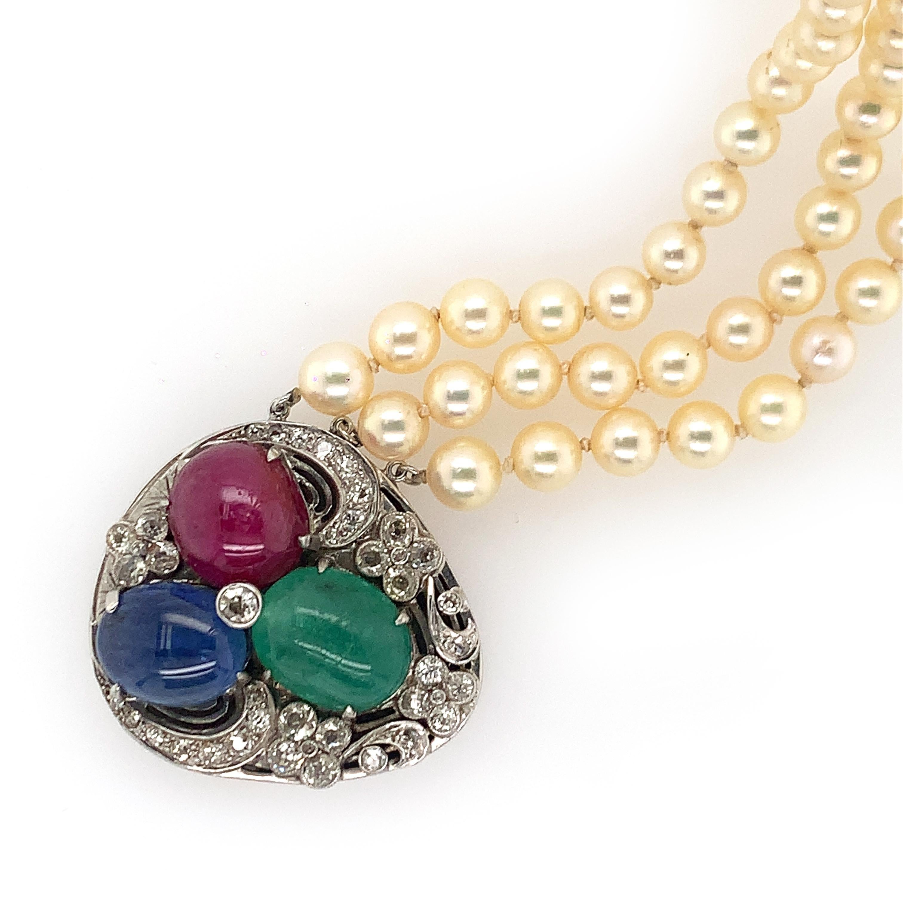 14K W/gold multi-colored stone diamond clasp/pendant pearl necklace. Old mine, old European cut diamonds weighing approx. 2.6 cts, J-K VS-SI, cab ruby weighing approx. 12.8 cts, cab emerald 9.85 cts, cab sapphire 11.50ct, signed SEAMAN 14K meausres