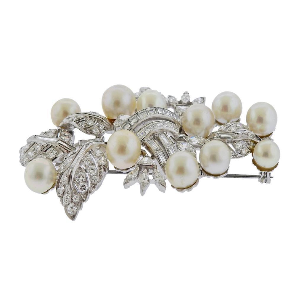 Impressive large platinum brooch by Seaman Schepps, set with 6mm - 8.5mm pearls and approx. 5.00ctw in diamonds. Measures 65mm x 44mm. Marked: Seaman Schepps, Irid. Plat.  Weight - 31.1 grams. PB-03027