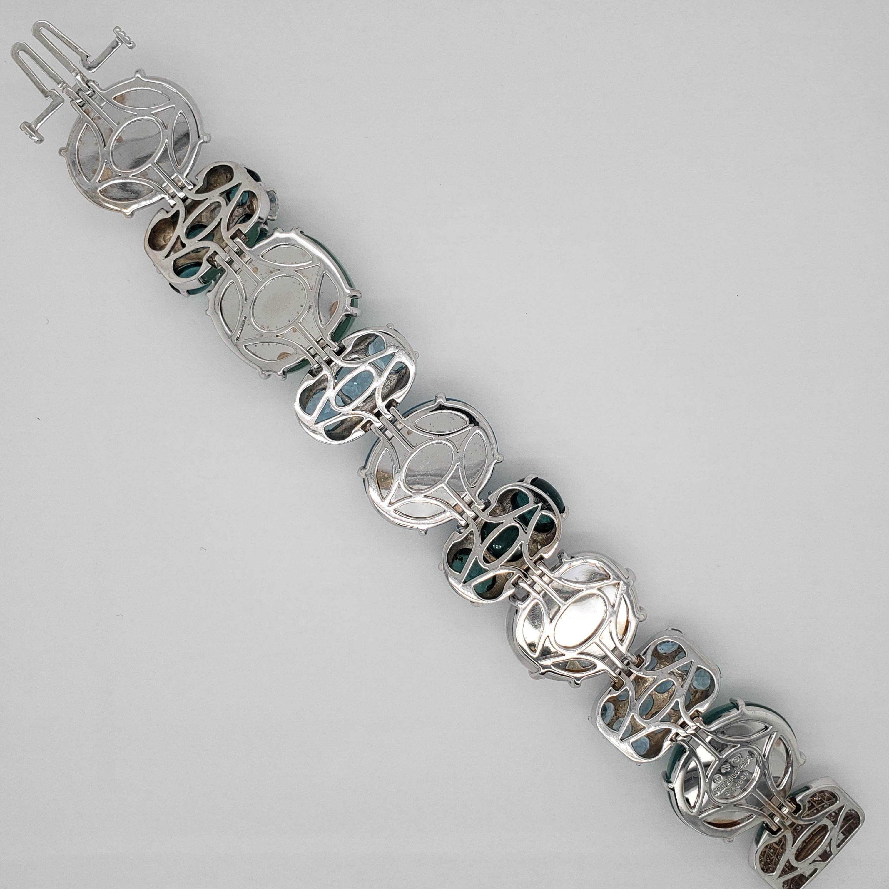 18k white gold Rio multi-gem & diamond bracelet. Crafted by well known designer Seaman Schepps

This bracelet has approx. 2.20cts of diamonds. 
Multiple blue toned gemstones. 
-Beryl
-Prenite
-Aquamarine
-Tourmaline
-Rainbow