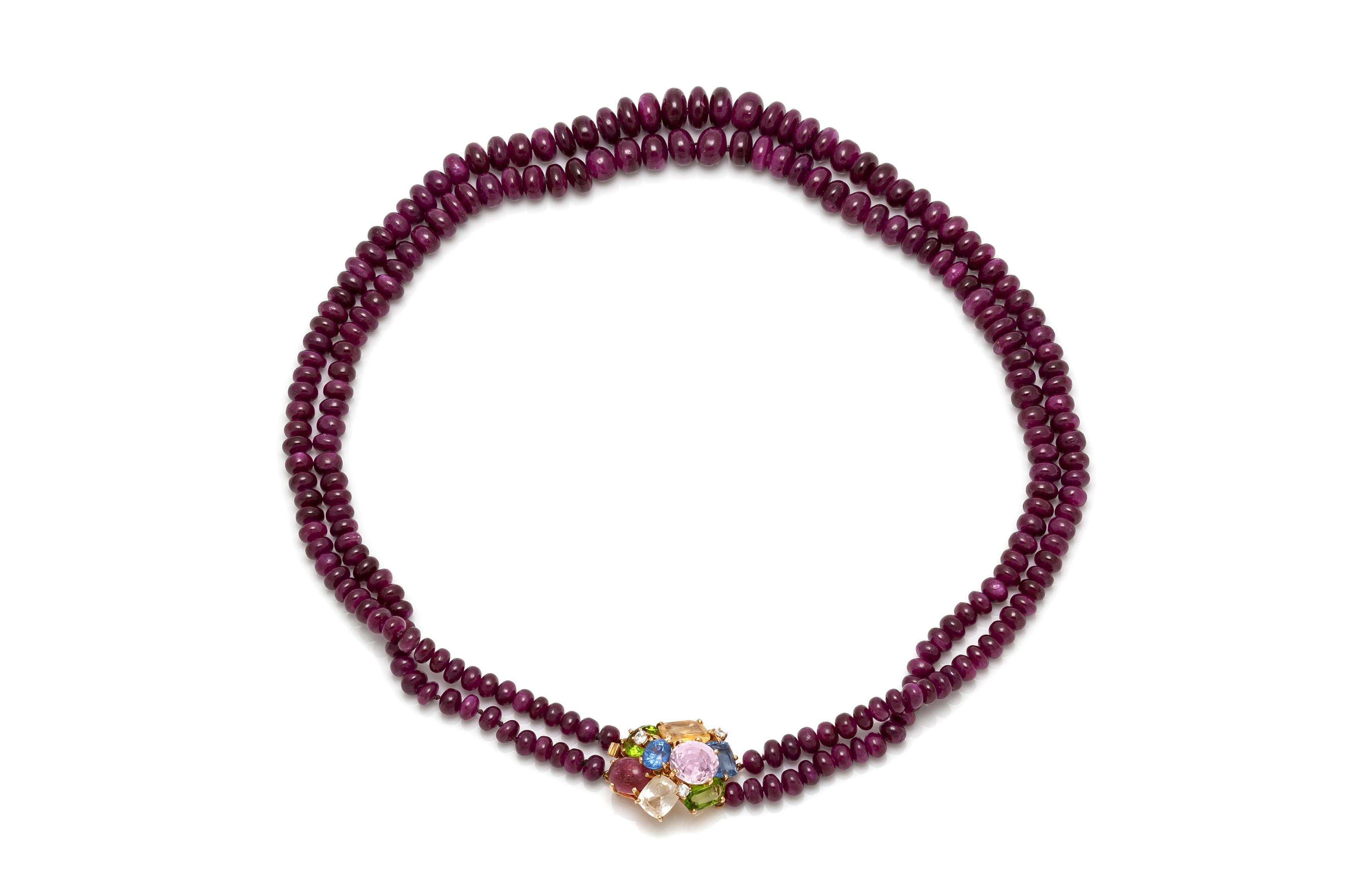 Seaman Schepps ruby beads necklace, finely crafted in 14k yellow gold with a beautiful clasp with multi-color rubies. Circa 1950's.