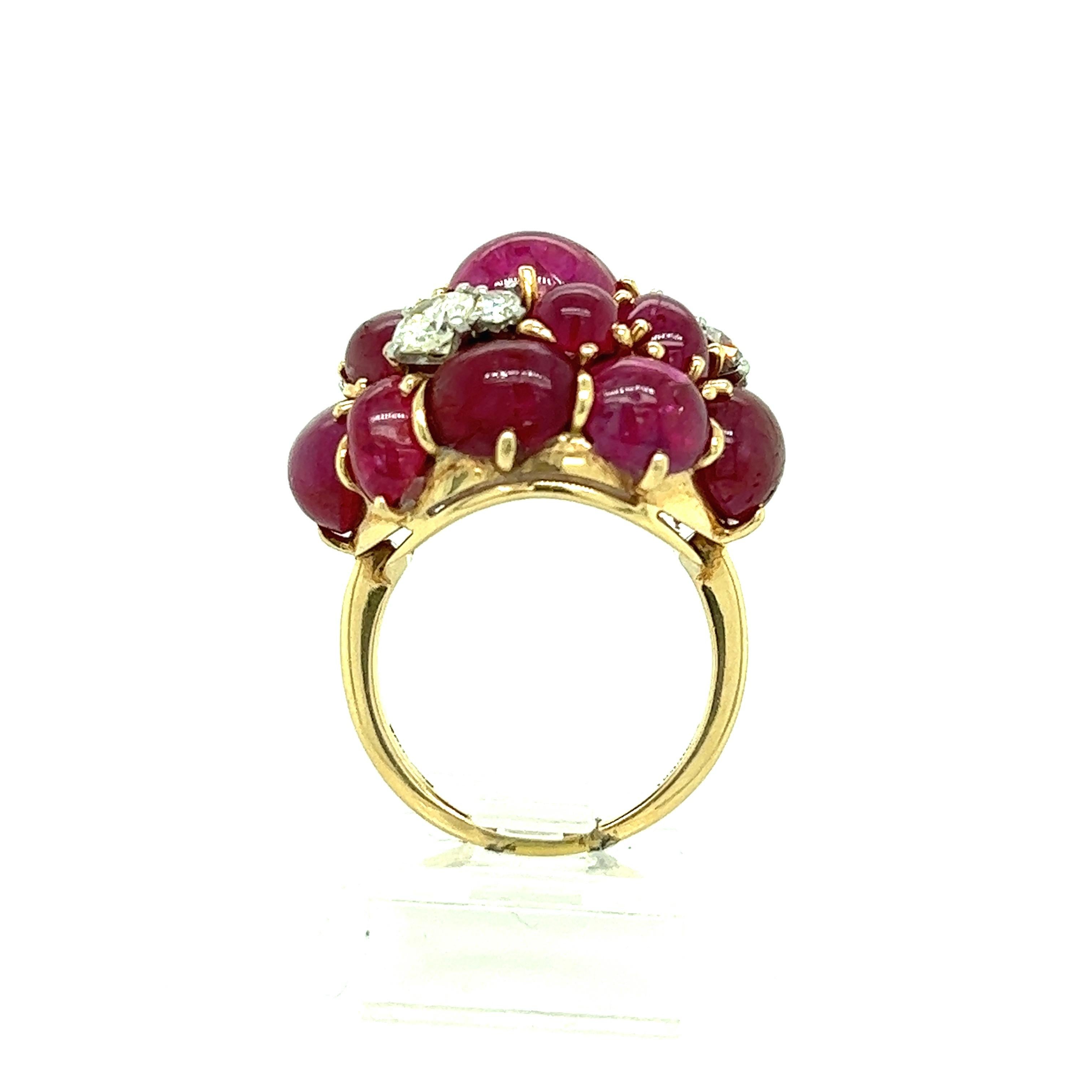 Seaman Schepps ring featuring approximately 25 carats of cabochon rubies from Burma and approximately 0.75 carat of diamonds. The stones are set on 18 karat yellow gold band. Marked 