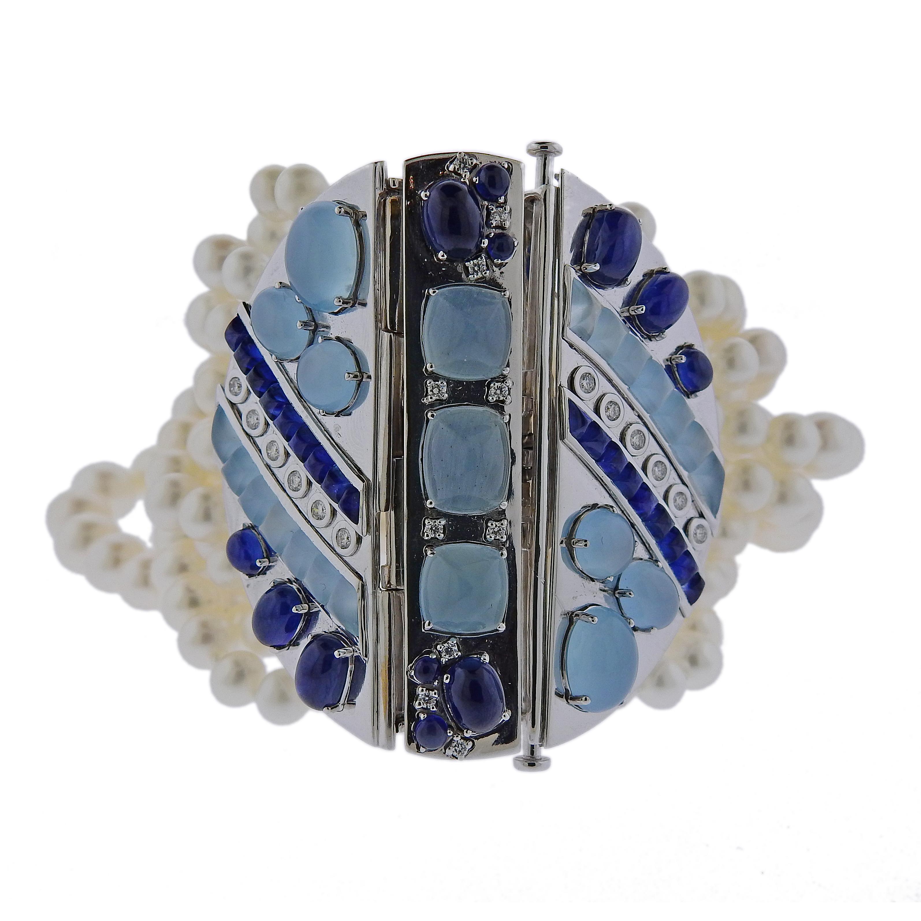 Impressive multi strand bracelet by Seaman Schepps, featuring 5.3-9mm pearls, aquamarines, sapphires, and approx. 0.46ctw in G/VS diamonds. Retail $50,400.00. Bracelet is 7.5