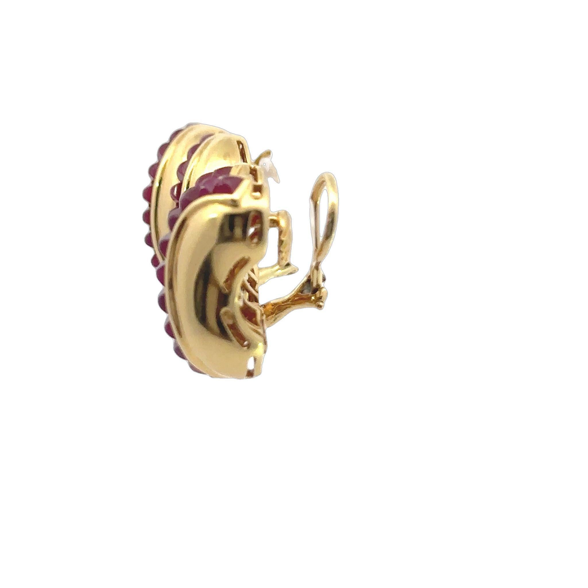 Seaman Schepps Ruby Clip on Earrings Sugarloaf Cuts 18K Yellow Gold ~5ctw Rubies

These Seaman Schepps Sugarloaf Ruby Earrings are innovative and playful, incorporating vibrant stones and unique cuts that stand out.
These earrings feature beaming