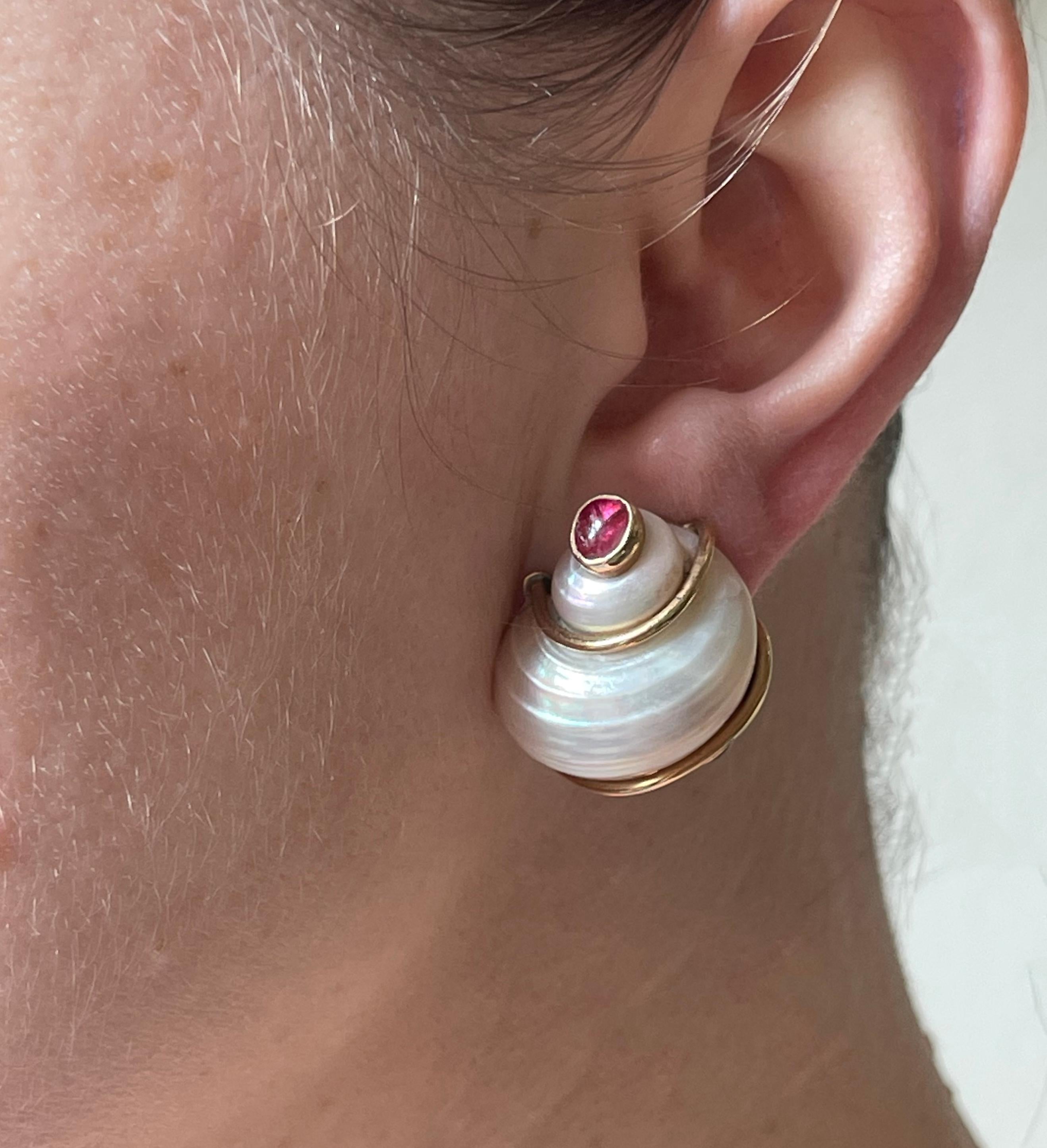 Pair of vintage Seaman Schepps turbo shell earrings, crafted by Patricia Shepps, with ruby and sapphire cabochons. Earrings measure 1 1/8