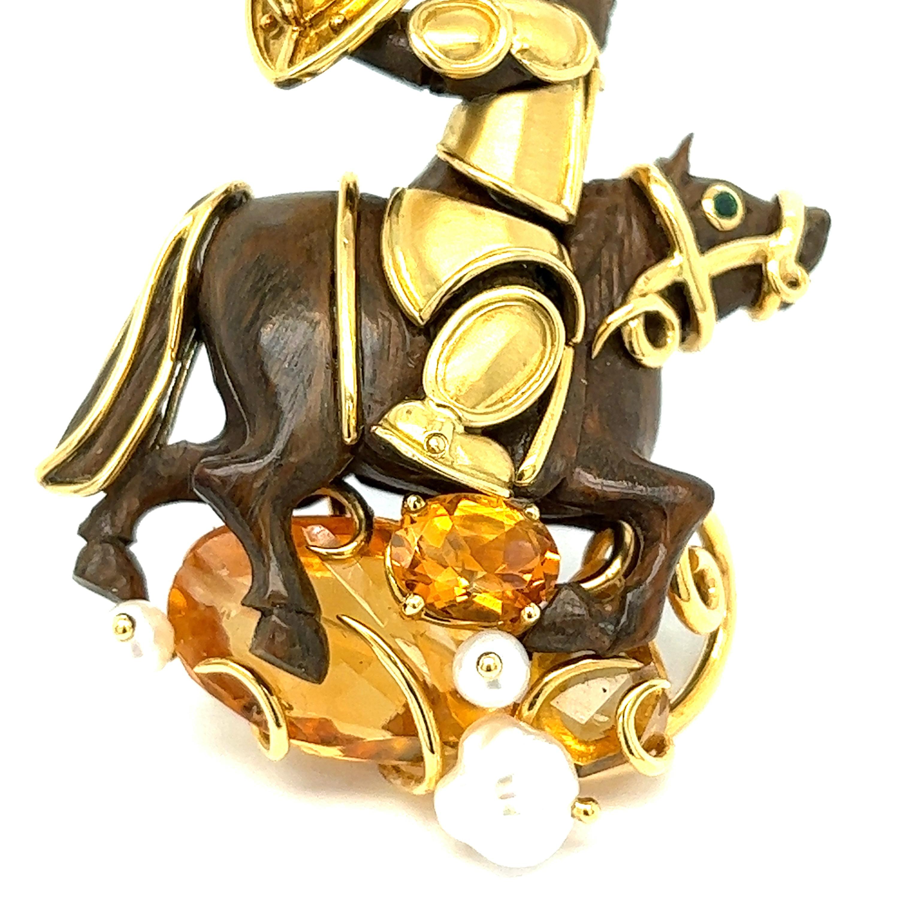 Seaman Schepps gold wooden brooch

An armored warrior on a horse, featuring citrine, amber, and pearls; 18 karat yellow gold; marked Seaman Schepps, 750, 19090

Size: width 1.31 inches, length 2 inches
Total weight: 19.5 grams