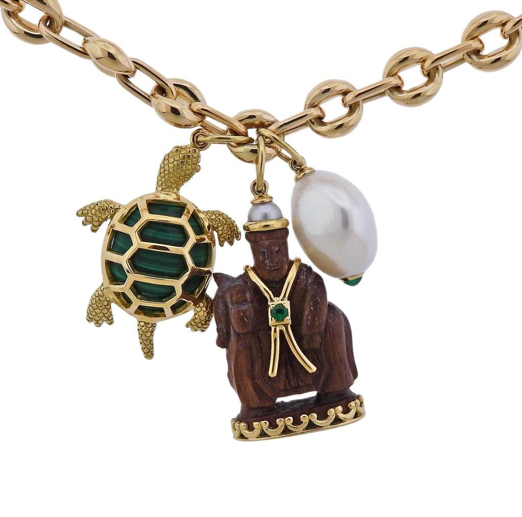 Brand New 18k yellow gold long chain necklace, complimented with three charm pendants - malachite turtle, carved wood Buddha and a pearl. All designed by Seaman Schepps. Necklace is 31.5