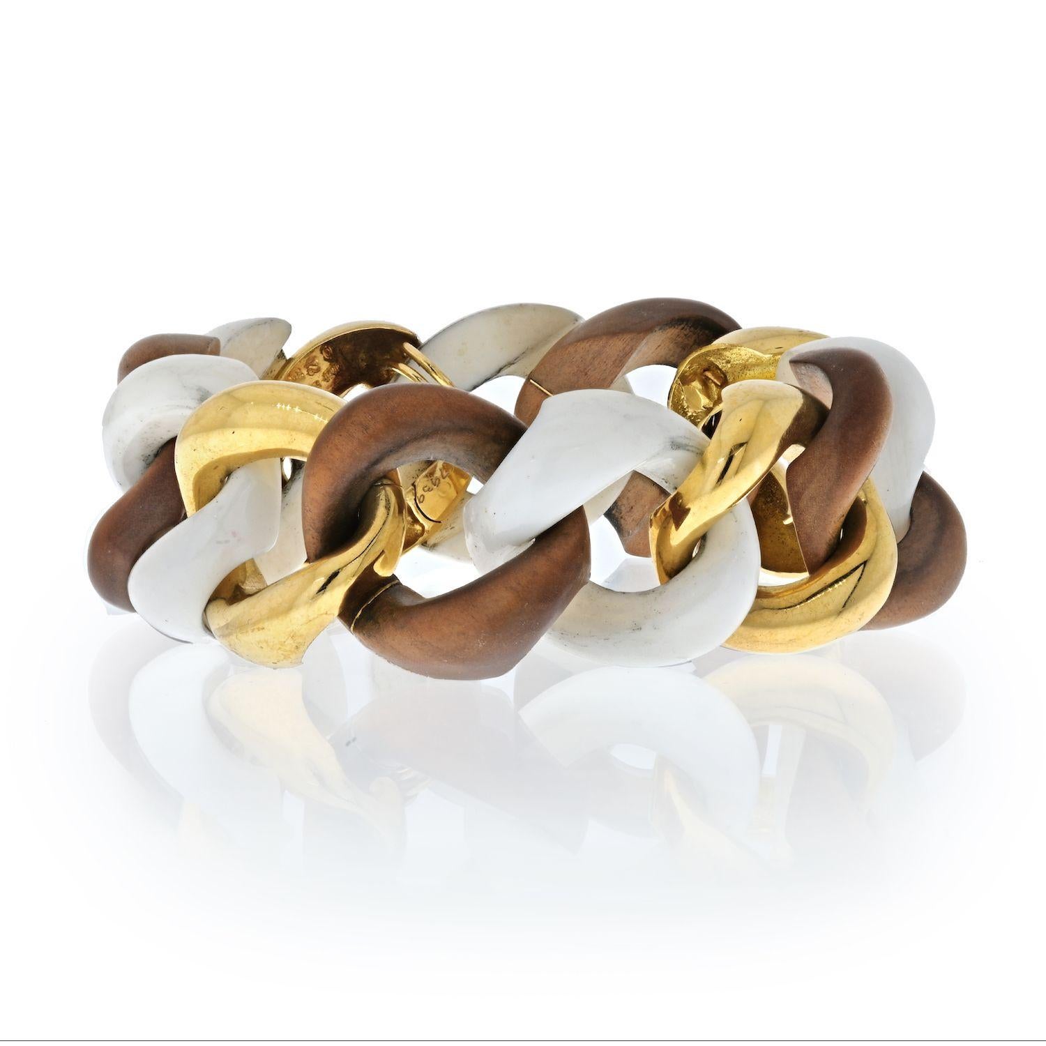 This is a Seaman Schepps 18K Yellow Gold Walnut Wood, White Ceramic And Gold Link Bracelet. Crafted in a signature curb link style. Length: 7.75 inches. Crafted to be worn loose. 
Width: 25mm.
Seaman Schepps client list includes Coco Chanel, Elsa