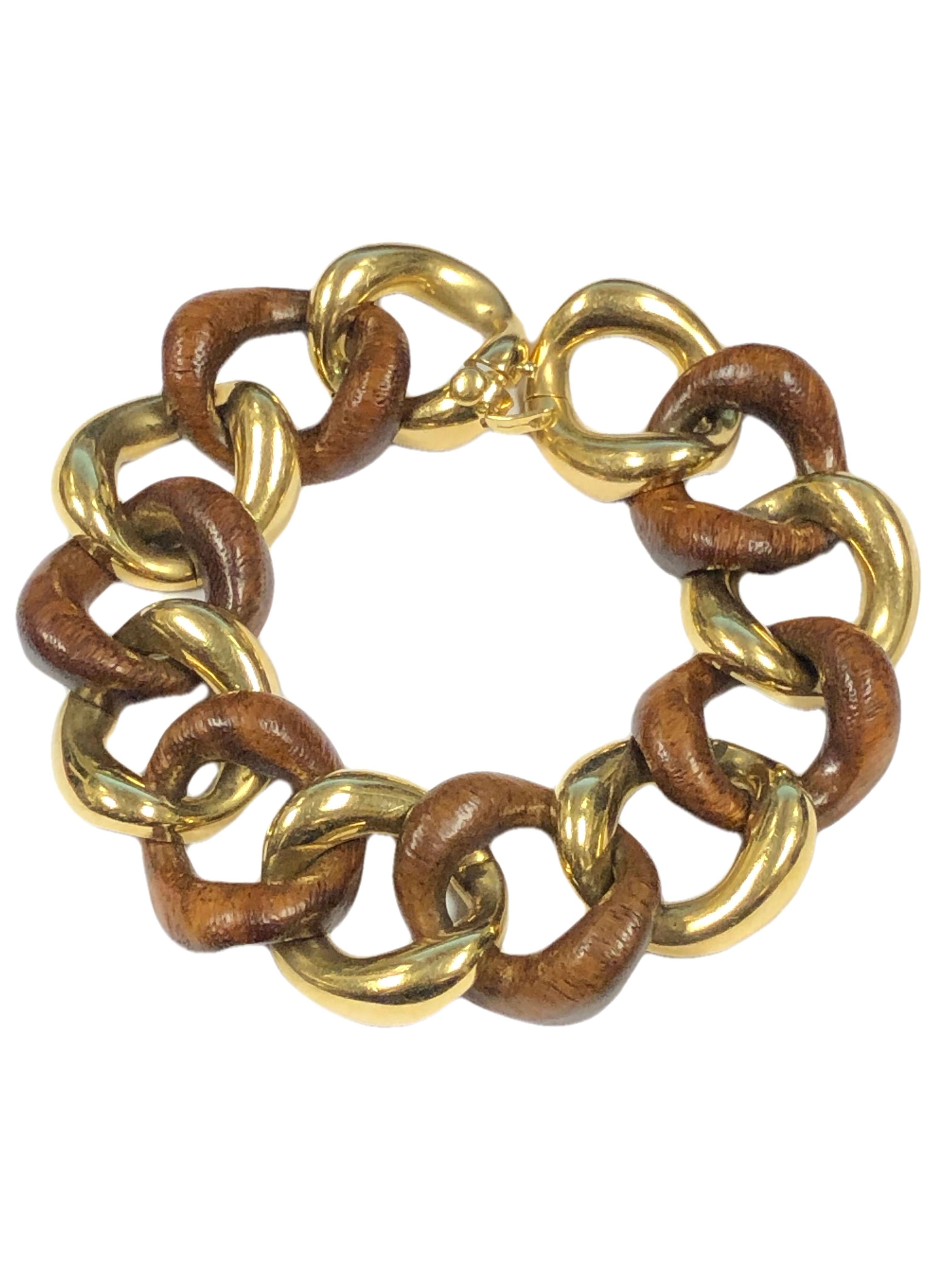 Circa 2005 Seaman Schepps 18K Yellow Gold and Wood Link Bracelet. Measuring 8 1/2 inches in length and 1 inch wide. This is in Excellent near unworn condition and comes in the original presentation box with outer box. 