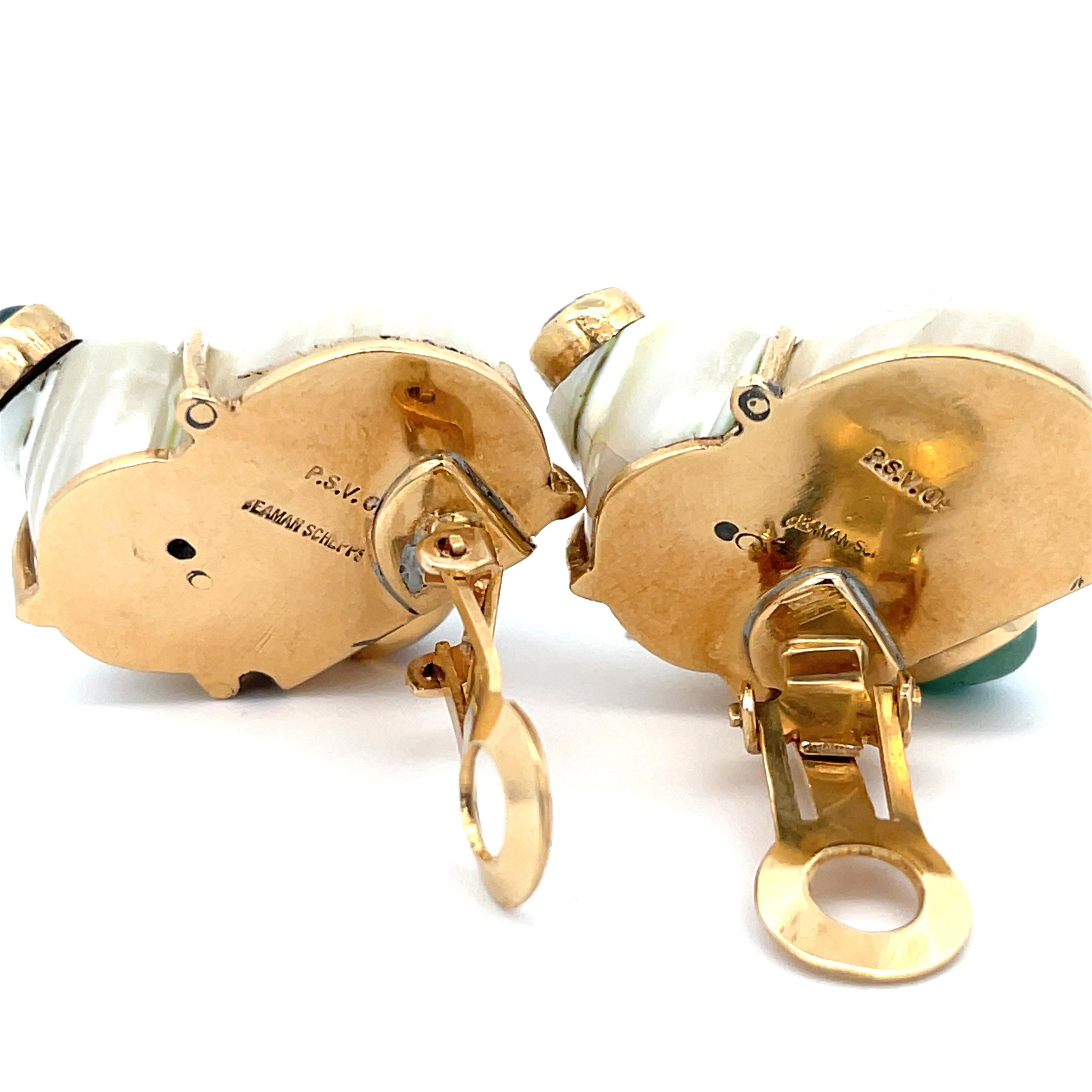Seaman Schweppes Shell Earring with Cabochon Gemstones in 14K Yellow Gold. The clip-on earrings feature four bezel set color gemstones. The earrings measure approximately 1