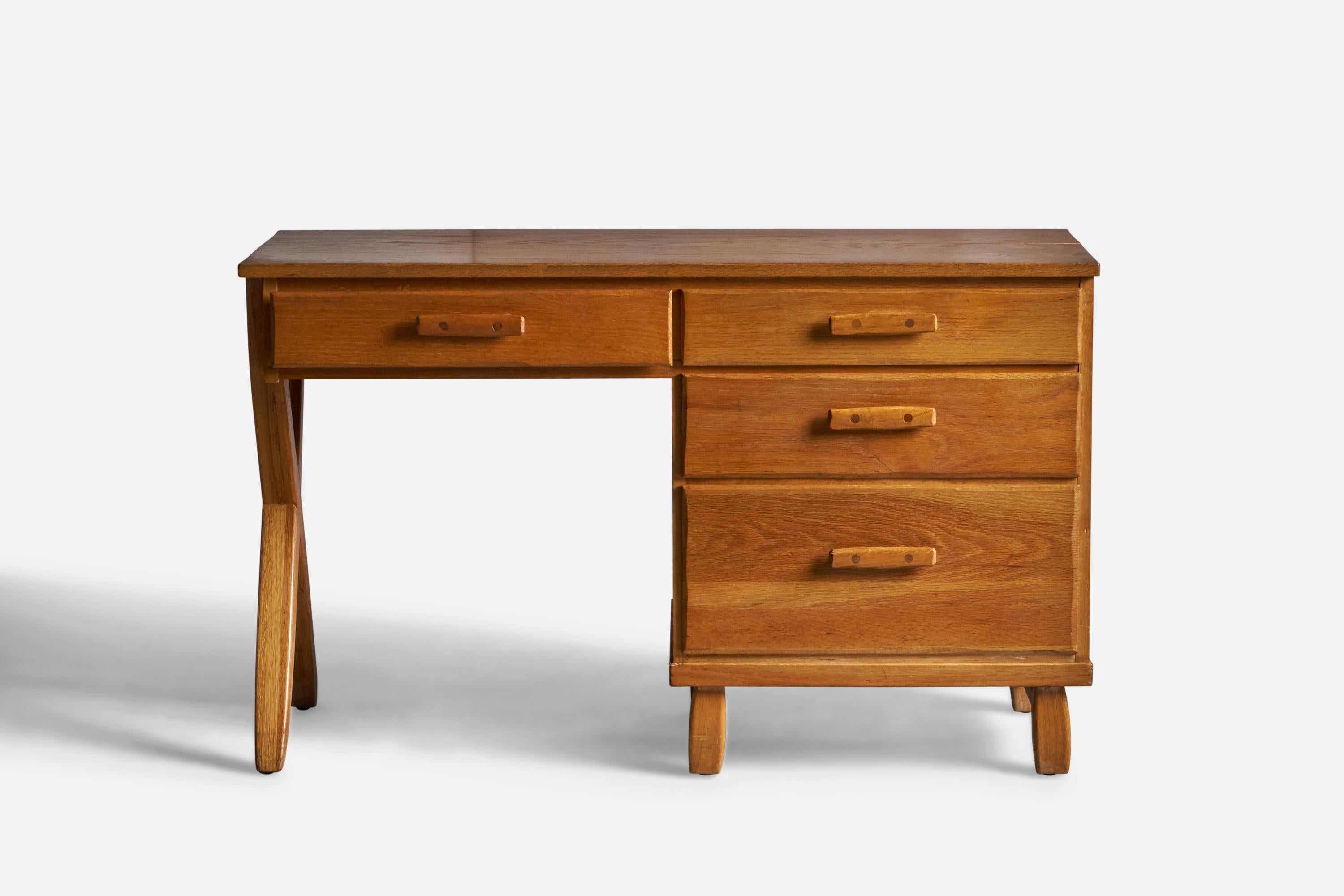 A small solid oak writing desk from the 