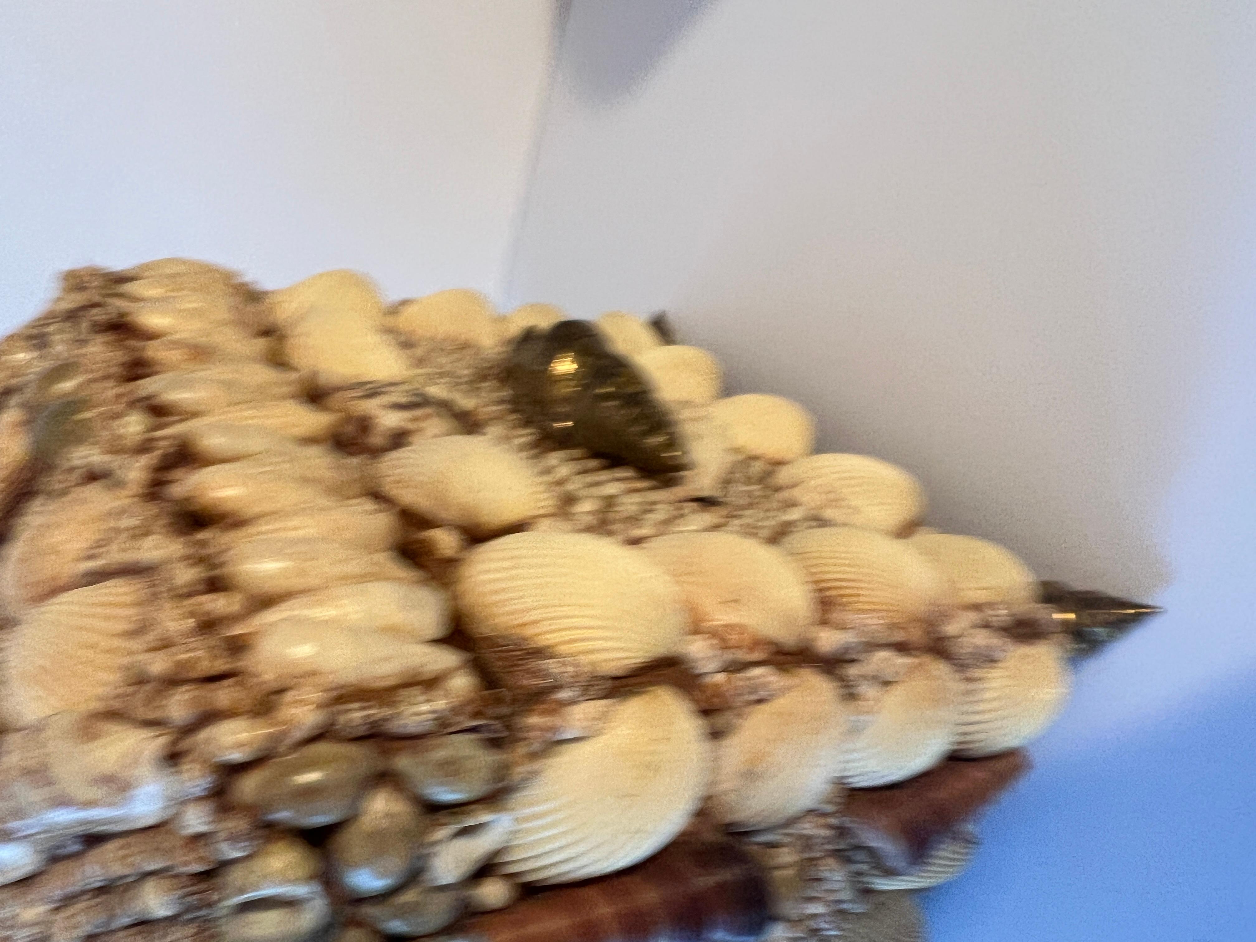 Seashell Encrusted Lidded Box with Feet and Handles of Brass Seashells In Good Condition In Los Angeles, CA