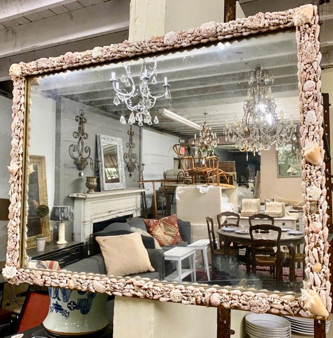 A beautiful rectangular mirror decorated meticulously with collected sea shells. This mirror can be hung vertically or horizontally. Add style and interest to hallway, mantle, powder room with Hollywood Regency or coastal style living.
Mantel