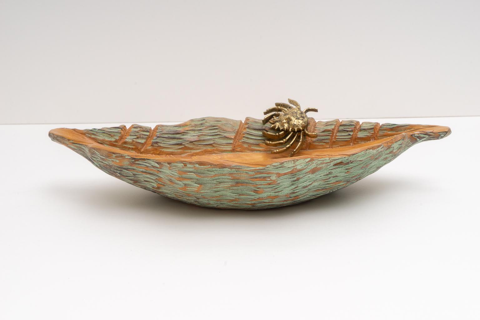 This stylish and chic serving dish is by Aldo Tura for Macabo Cusano and dates to the 1950s-1960s. The piece is handcrafted in the form of seashell with a bonze crab figure.