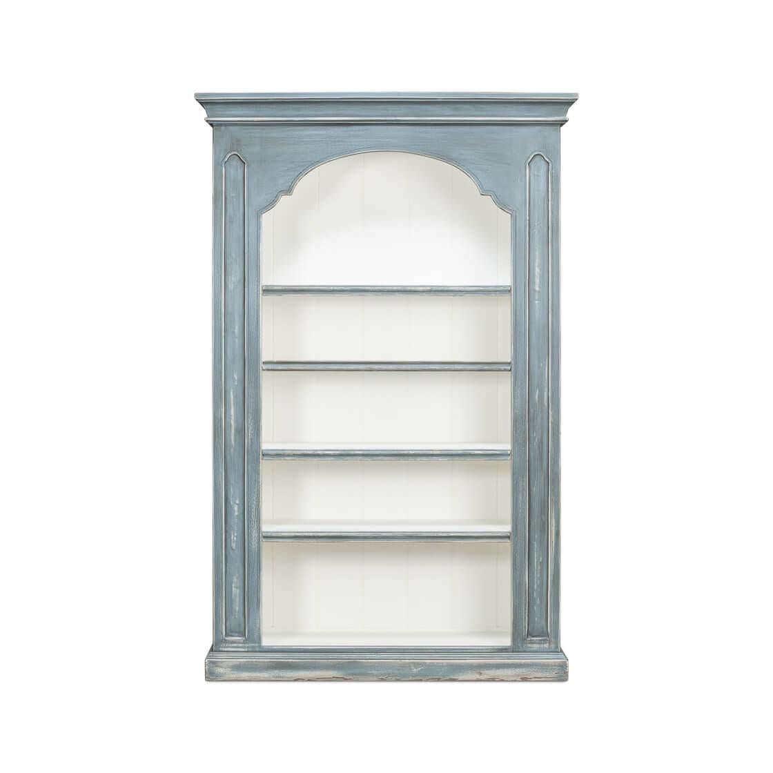 With its calming hues and classic design, reminiscent of a cherished heirloom. The soft blue finish, gently distressed to reveal hints of natural wood, evokes the feel of weathered beachfront shutters.

This bookcase's grand arch crowns its open