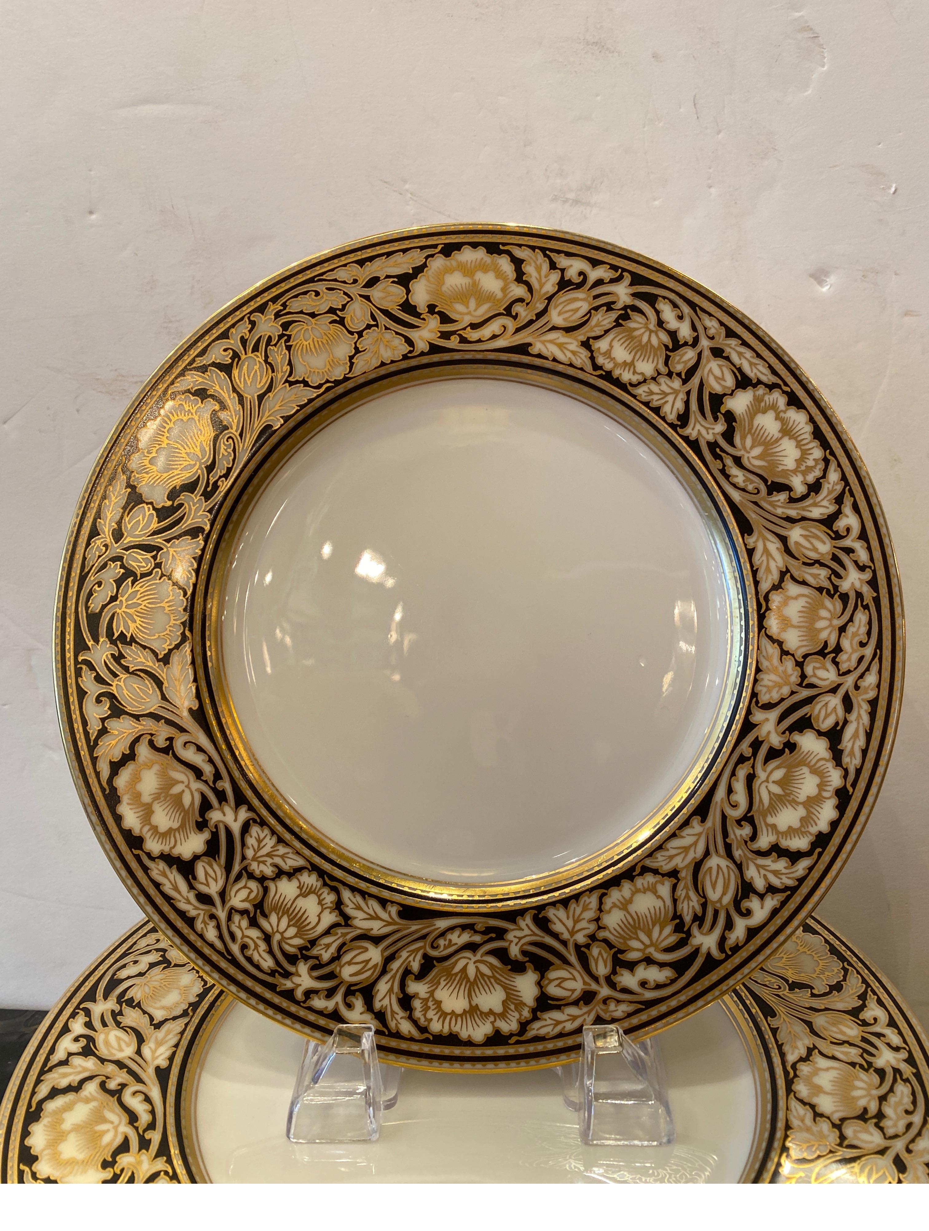 A set of 12 early 20th century black and gold border service dinner plates. Elegant broad border in a hard to find black and gold with a pre 1930 Lenox green mark on back, 10.5 inches in diameter, excellent condition.