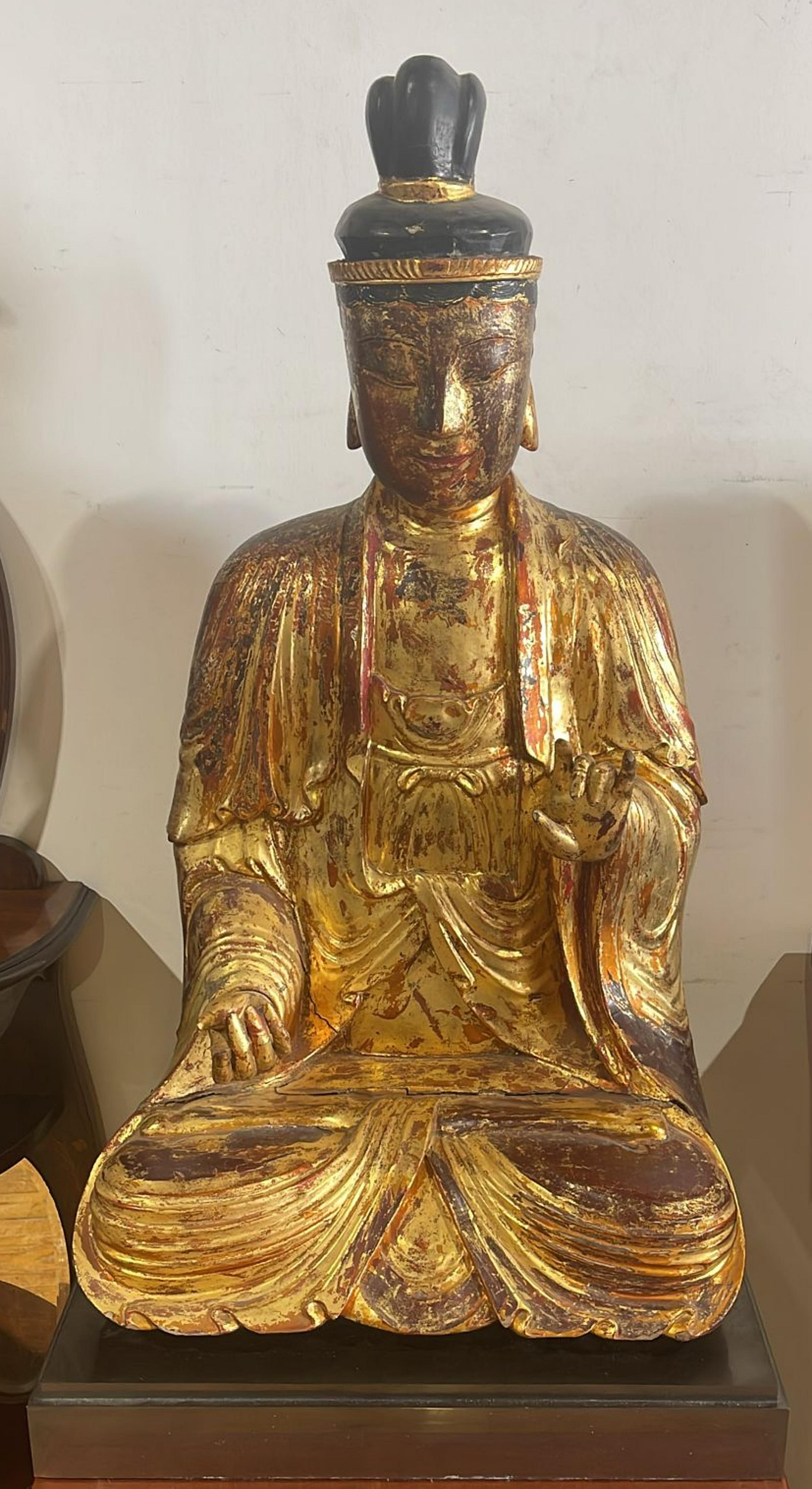 SEATED BUDDHA KUAN YIN/GUANYIN

19th-century Chinese sculpture in polychrome and gilded wood. Rests on a later painted wood base.
Signs of wear.
Height: (sculpture) 82 cm; (total) 173 cm
Good condition