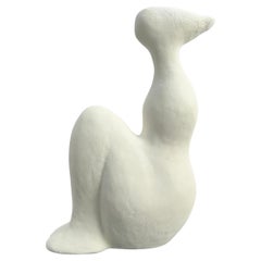 Seated figure white abstract sculpture
