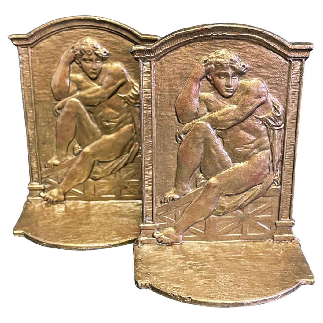 "Seated Male Nudes, " Pair of Bookends with Figures in Michelangelo-Esque Poses For Sale