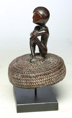 Seated Philippine Miniature Bulul Figure Sitting on Old Hat or woven Basket Top