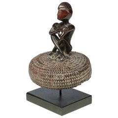 Antique Seated Philippine Miniature Bulul Figure Sitting on Old Hat or woven Basket Top
