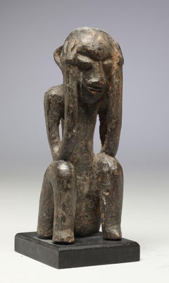 Seated Philippine Miniature Bulul Figure with Hands on Side of Head, Eroded