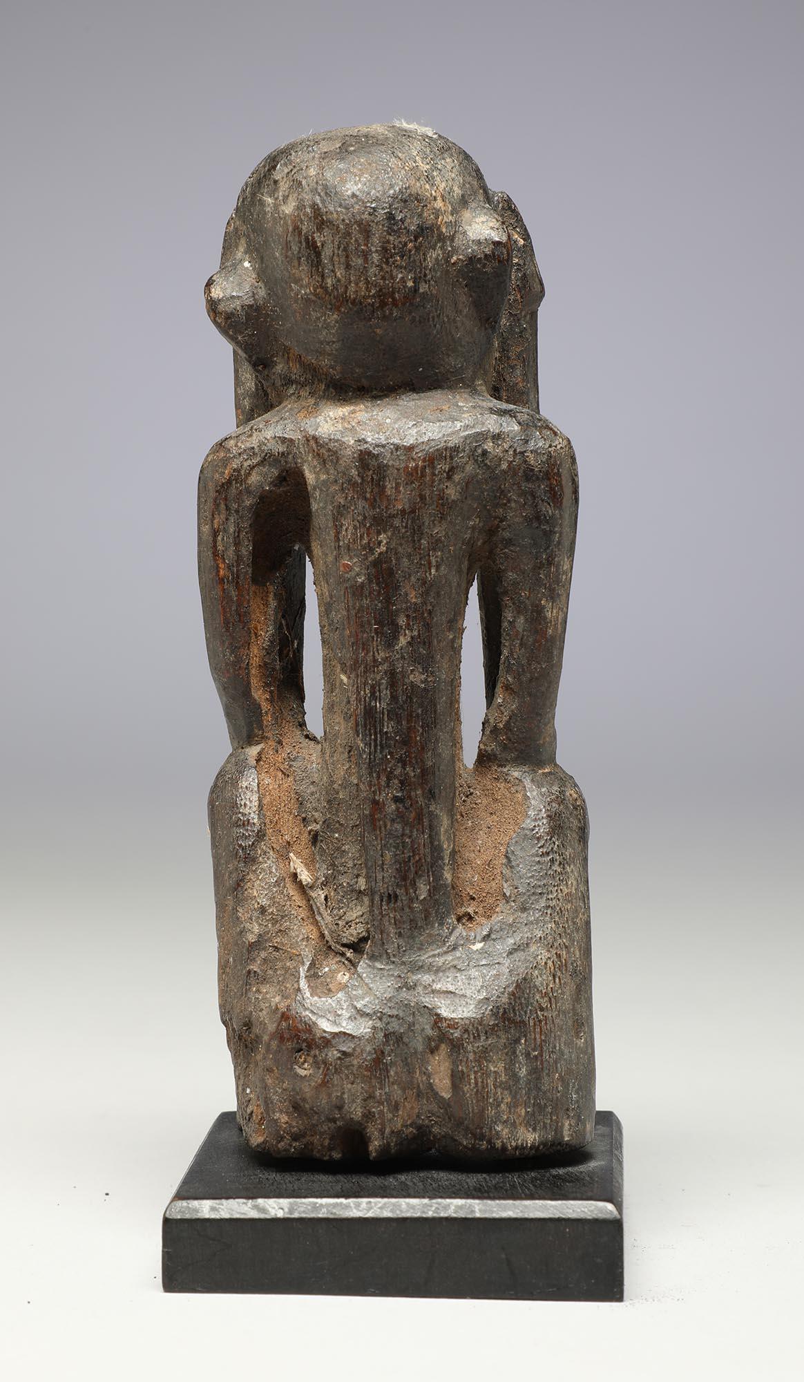 Tribal Seated Philippine Miniature Bulul Figure with Hands on Side of Head, Eroded For Sale