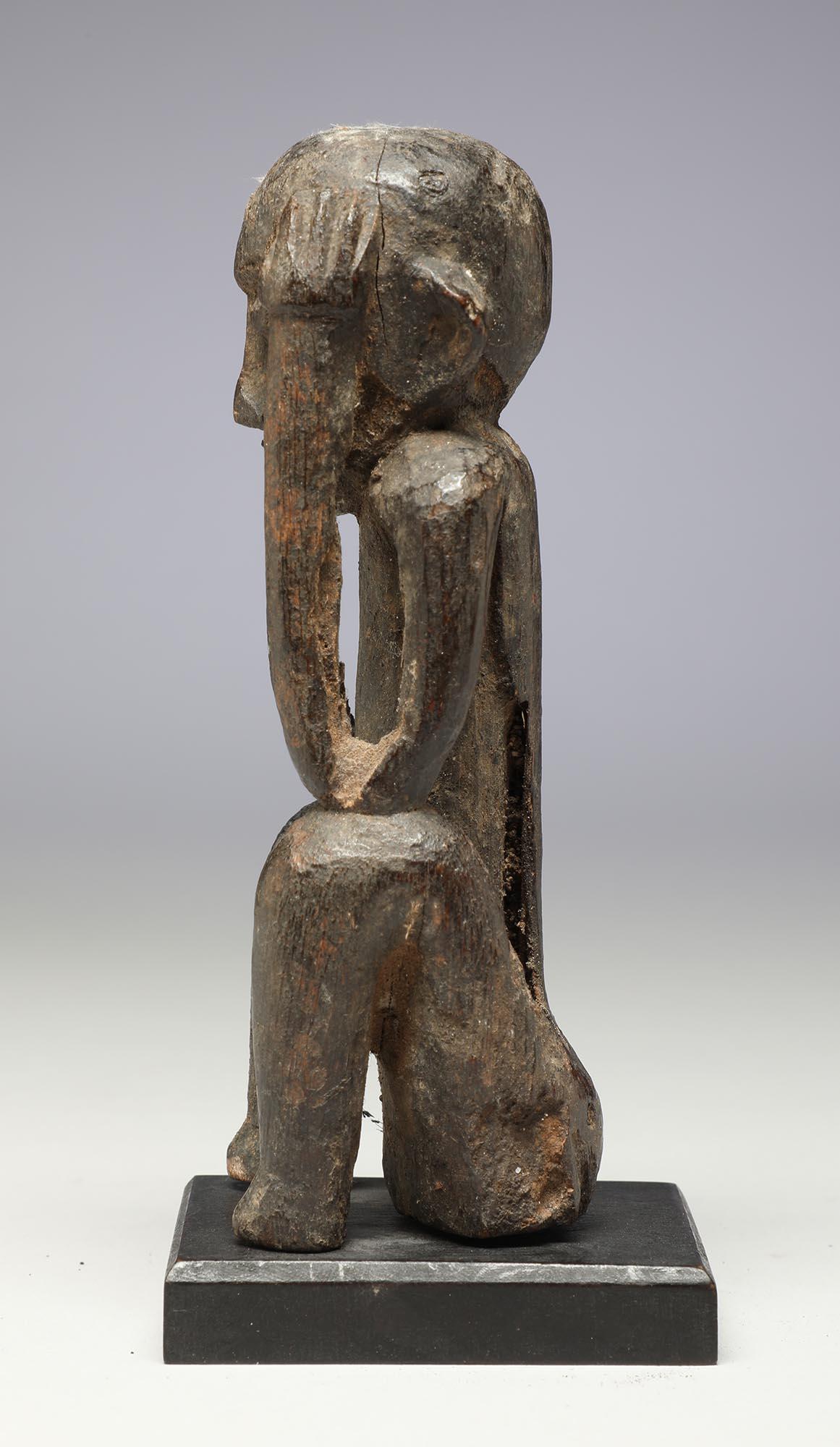 Hand-Carved Seated Philippine Miniature Bulul Figure with Hands on Side of Head, Eroded For Sale