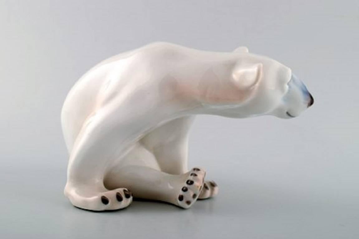 Seated polar bear, Royal Copenhagen No. 409.
First assortment. In perfect condition.
Measure: Height 11 cm, length 20 cm.
Two pieces. In stock.