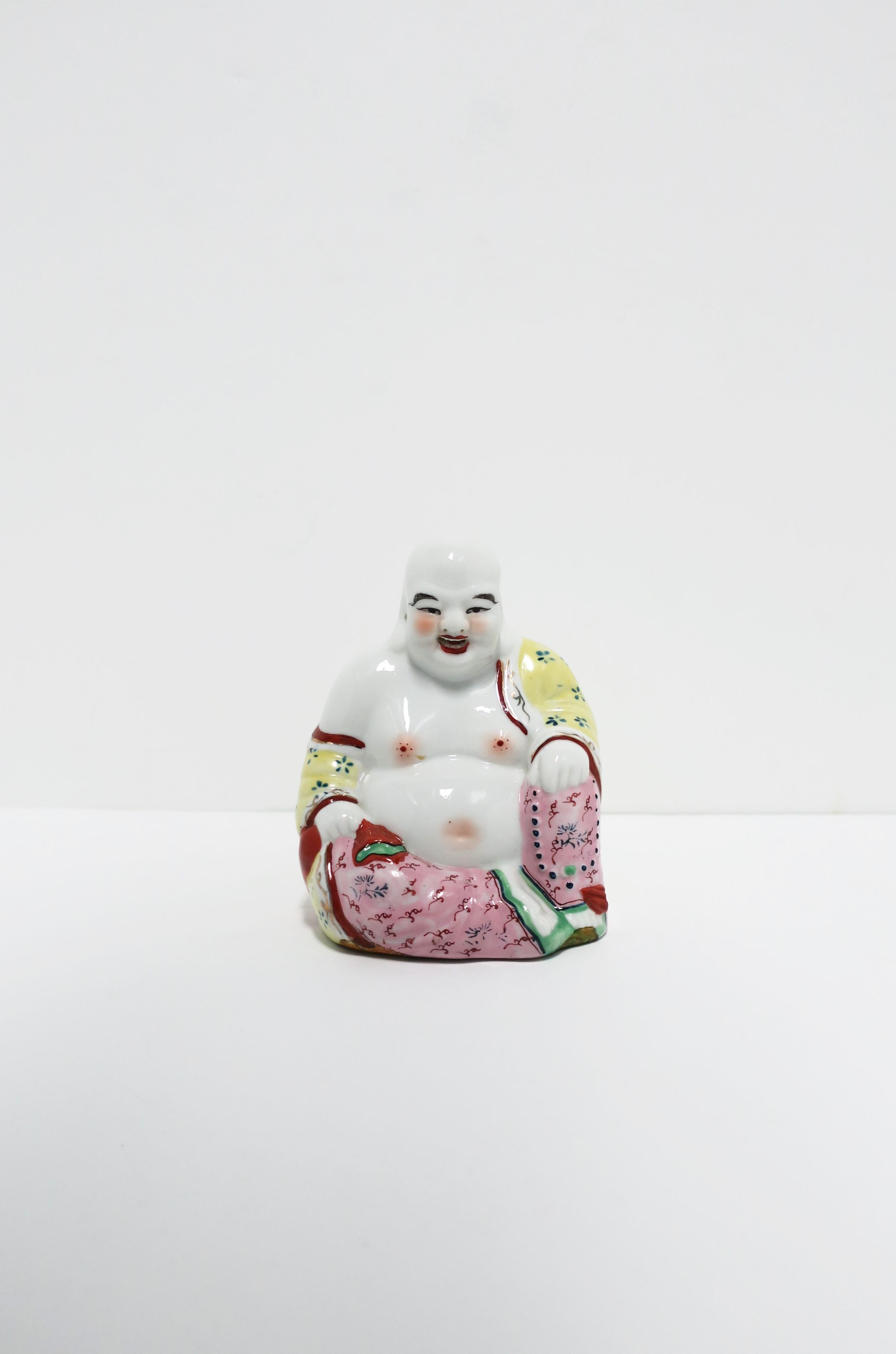 A vintage seated porcelain Buddha Famille Rose, circa 20th century, Asia. Dimensions: 2.88