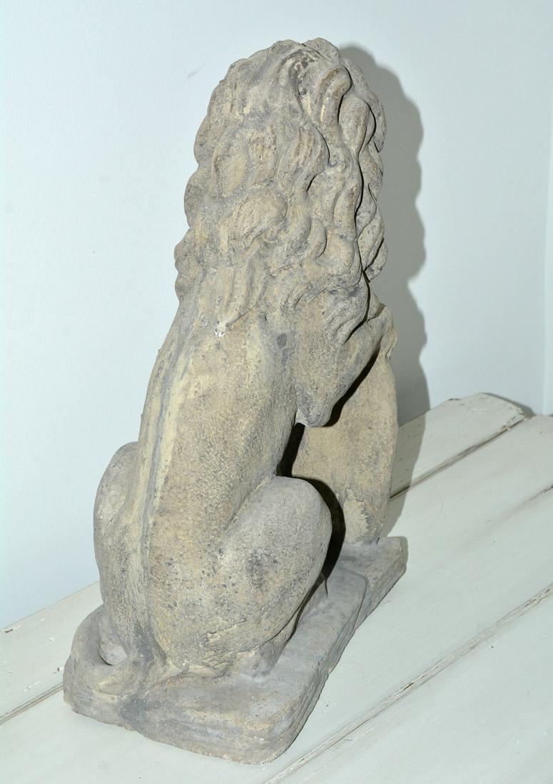 English Seated Cast Stone Lion with Shield For Sale